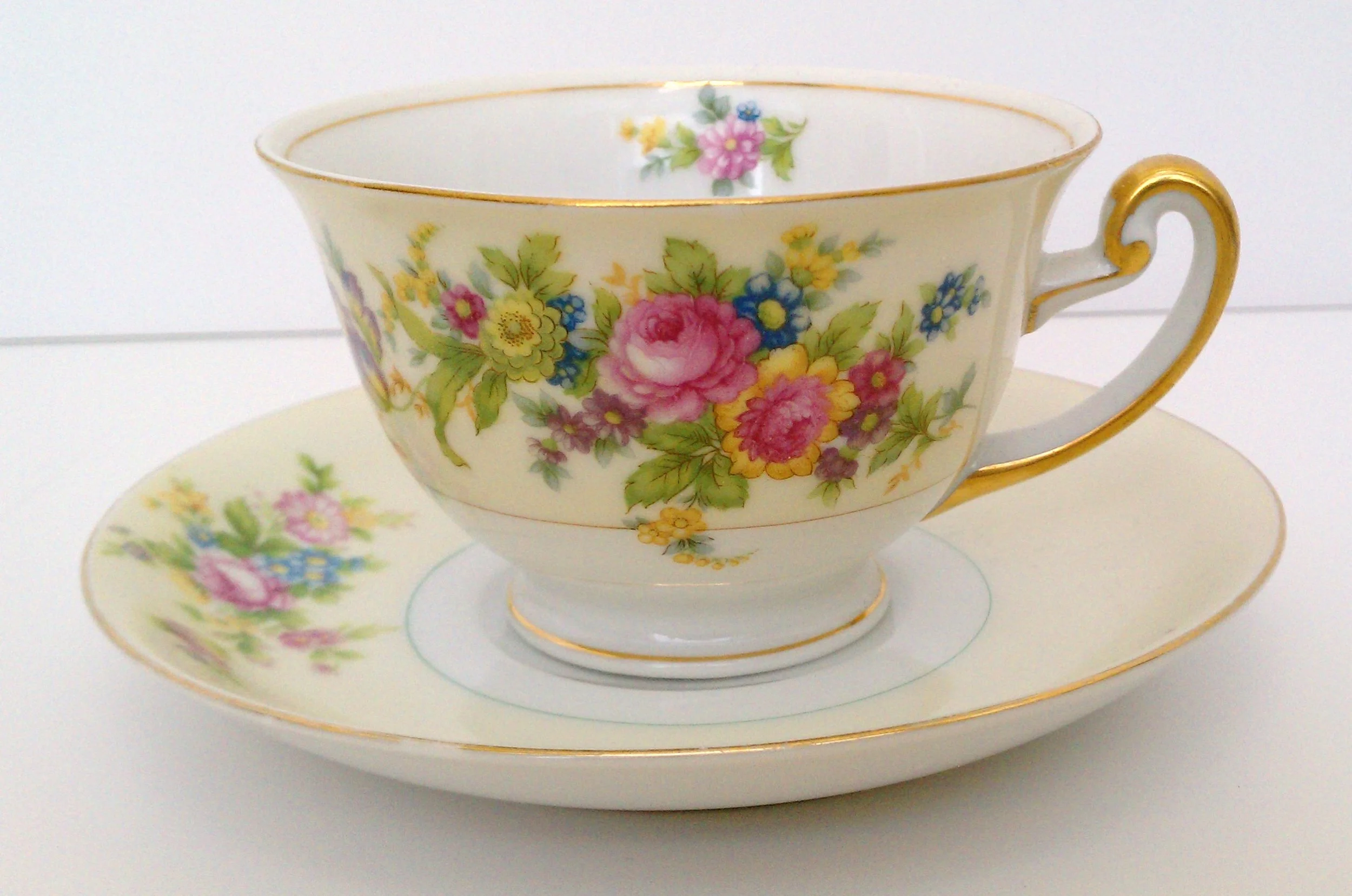Pale yellow and white with pink and blue floral motif ... F&B (Meito) China ... made in Japan