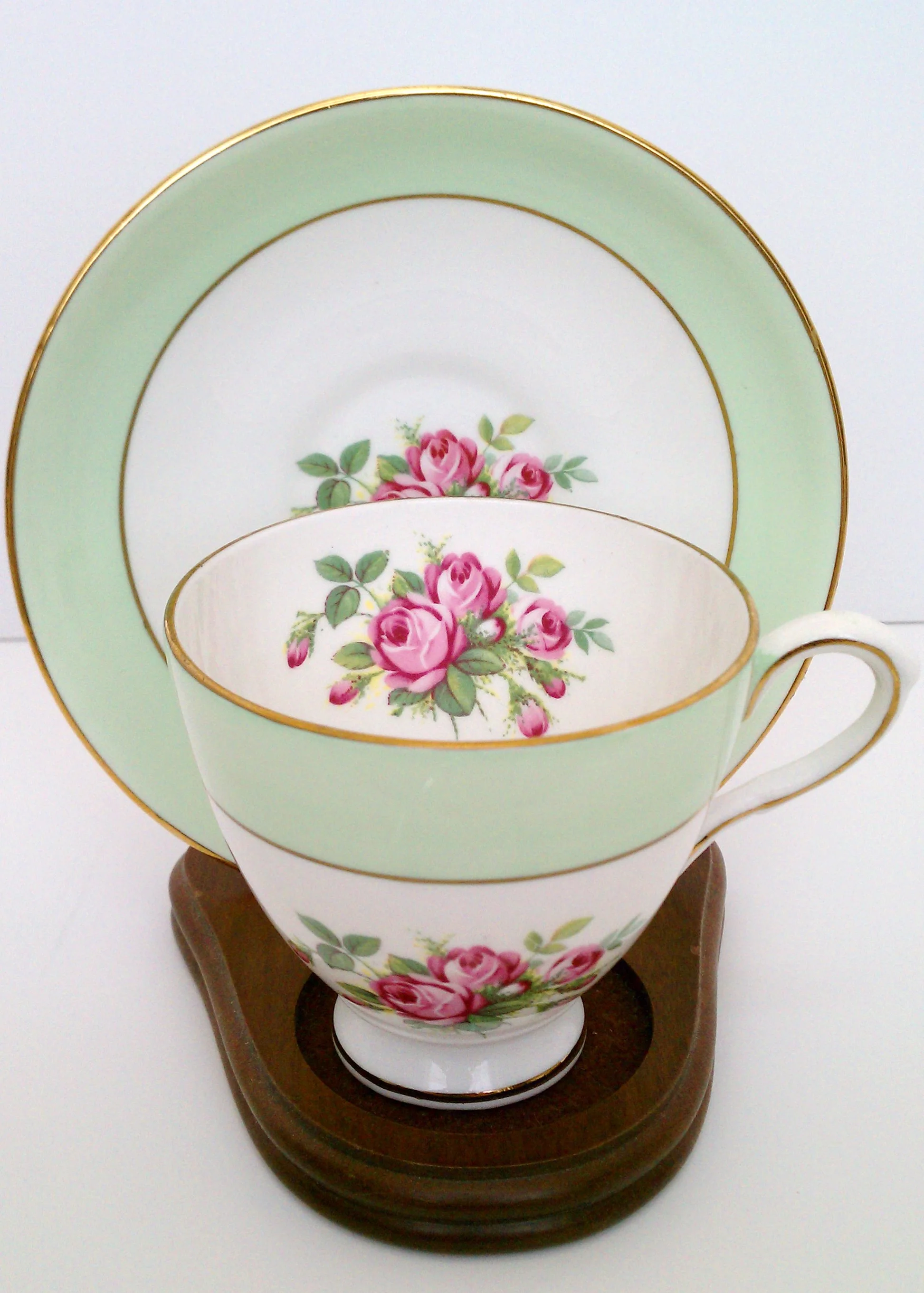 Green and white cup and saucer with pink rose motif ... Royal Taunton bone china made in England