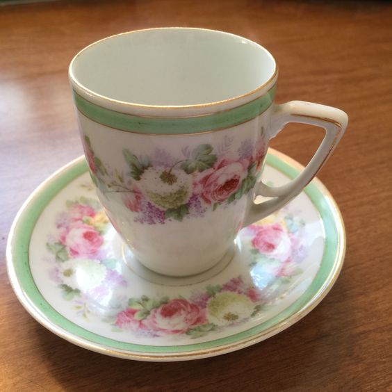 German pink and green demitasse cup and saucer