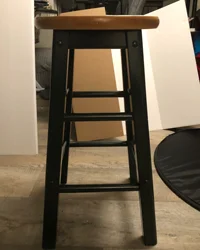 Flat surface such as a table, in this case I used a stool. (Although, a table would probably have been smarter.)
