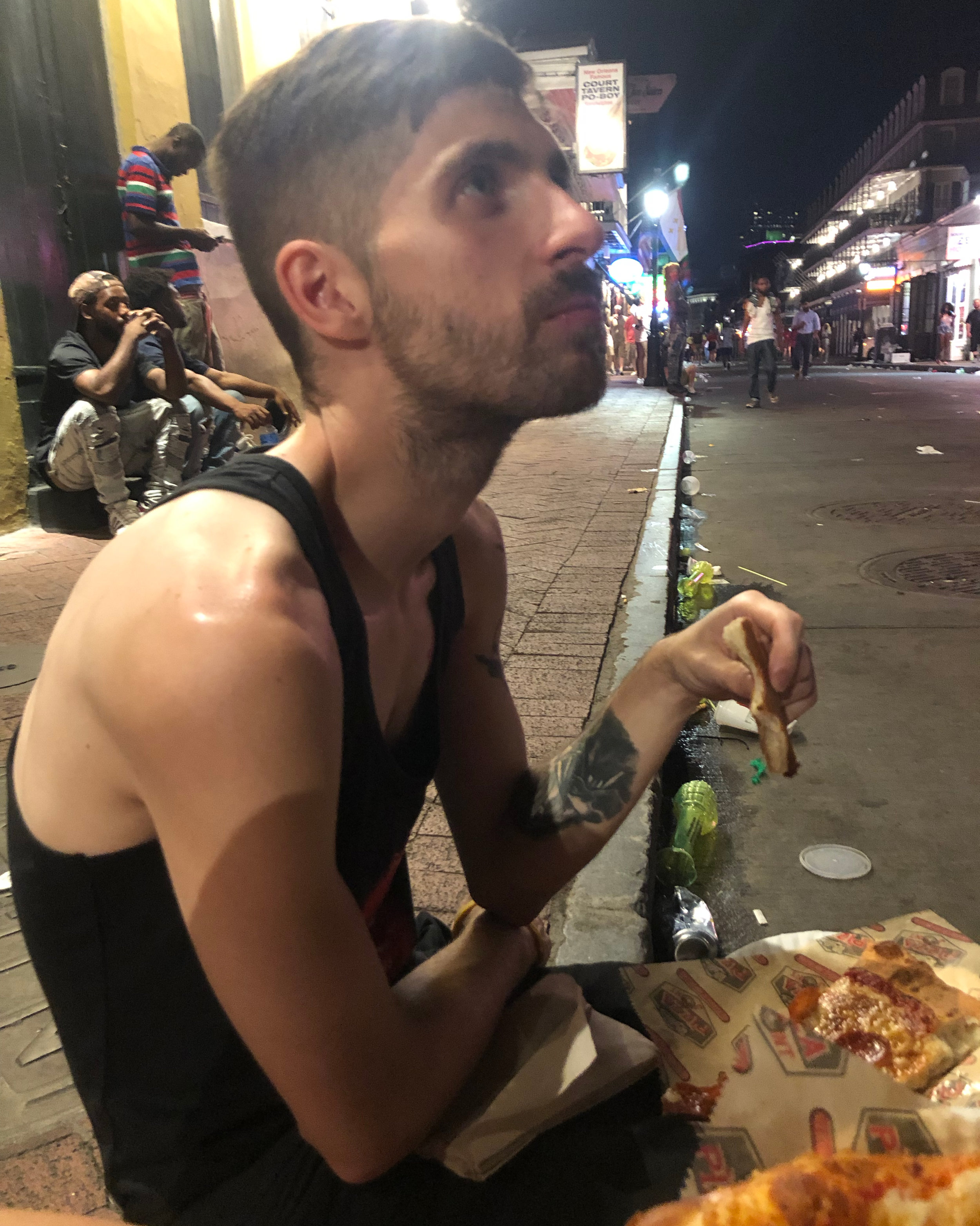 Shortly before I sang to the homeless man, Nathan and I were eating Willie’s Pizza, while sitting on the curb. (The pizza was amazing and greasy— PERFECT DRUNK FOOD!)