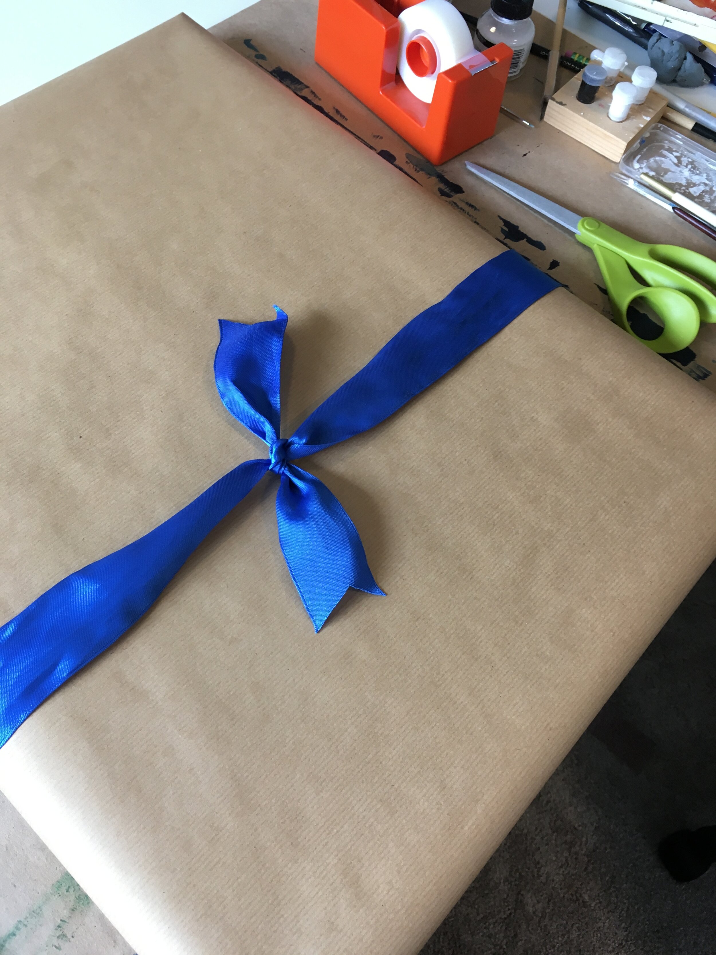 blue painting with a blue bow