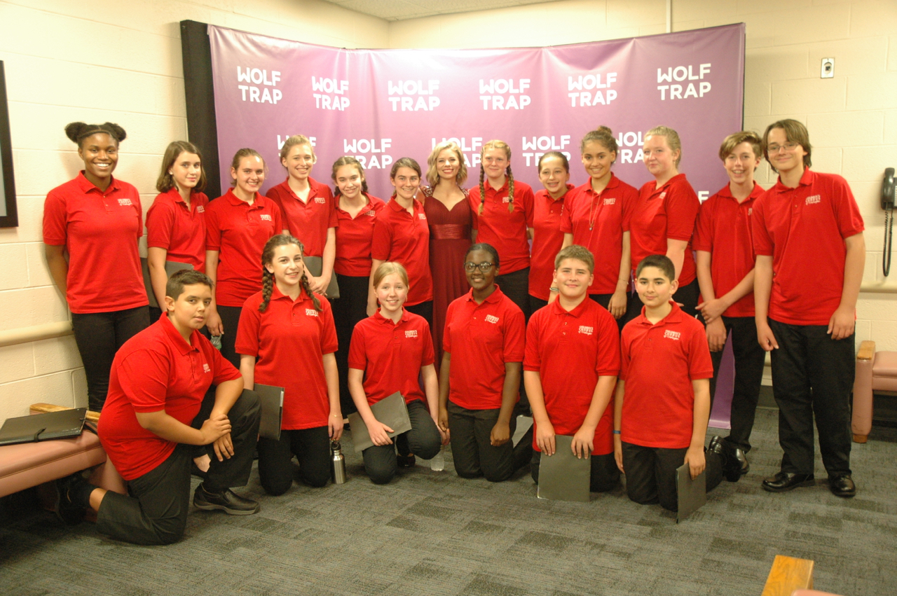 Choristers pose with soprano soloist Amy Owens