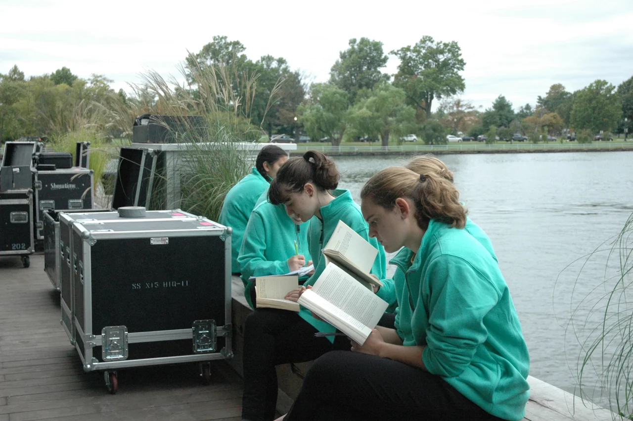 Concert Chorus members enjoy some quiet time outside before the performance