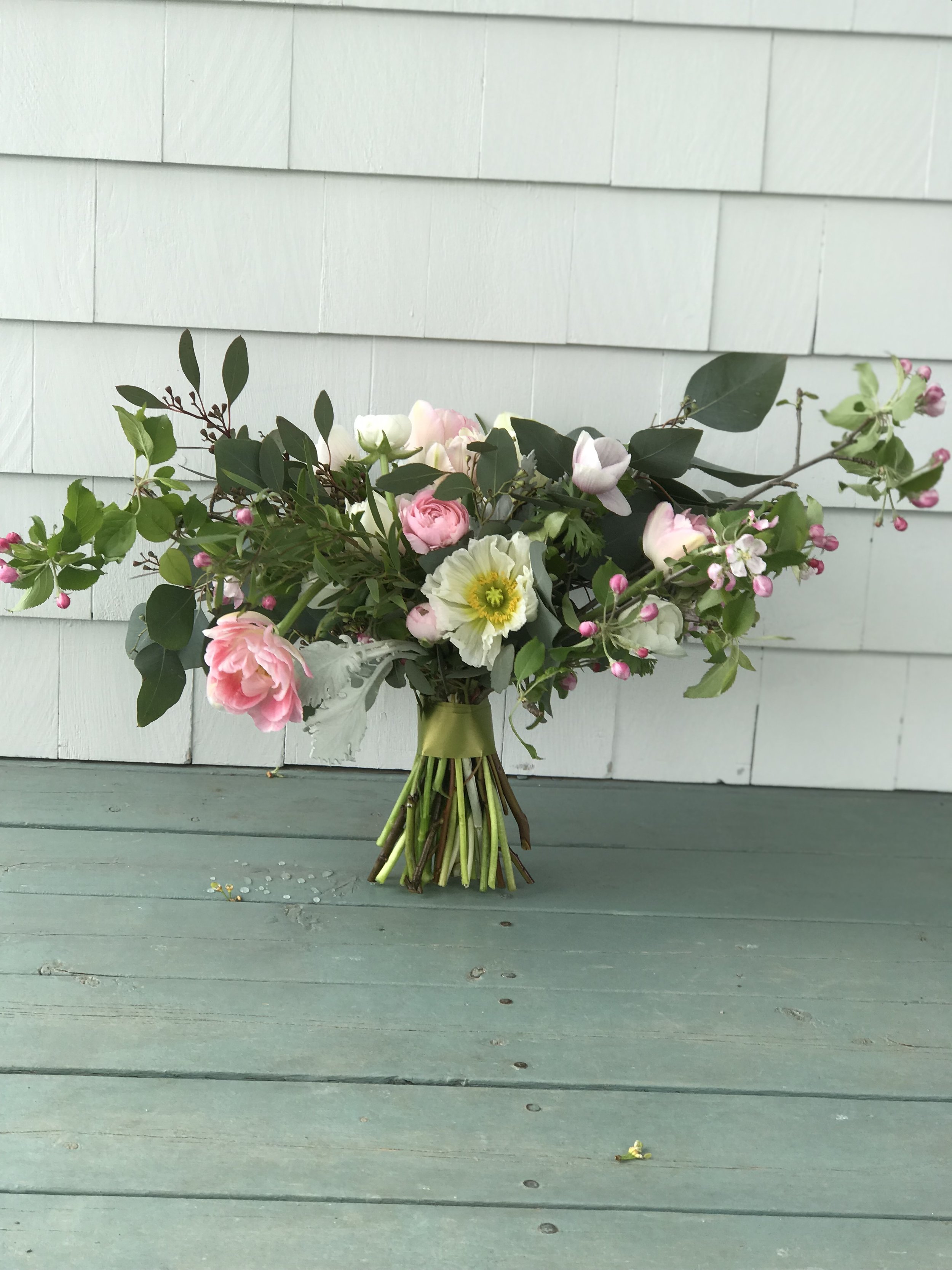 Tulip, poppy and apple blossom bridal bouquet