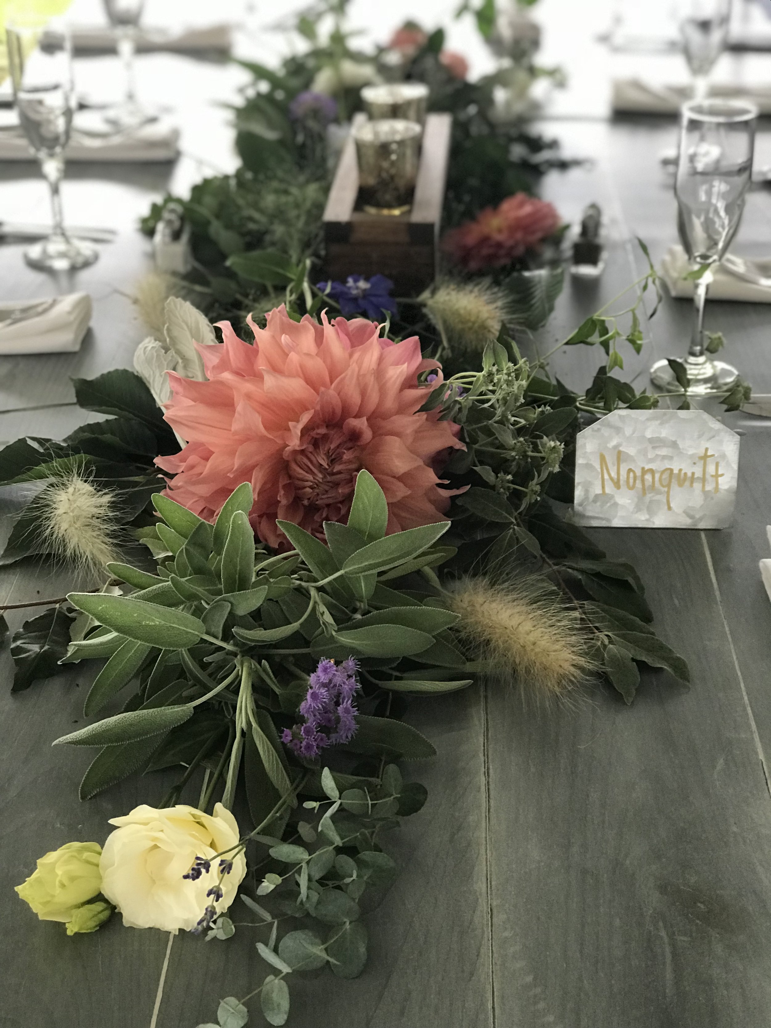 Up close of table garland with flowers