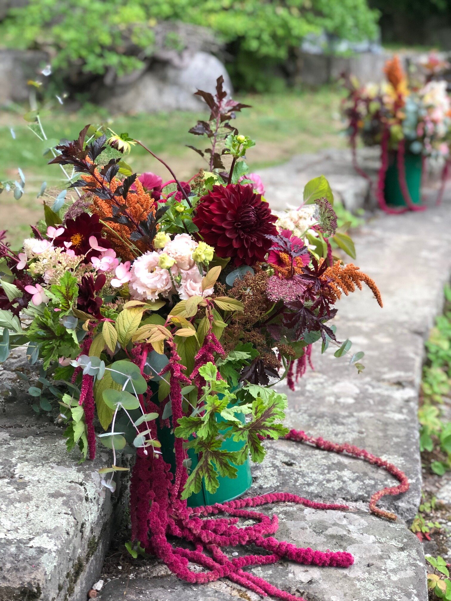 September ceremony decor featuring fall tones and amaranth