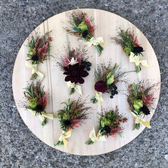 fall toned boutonnieres.