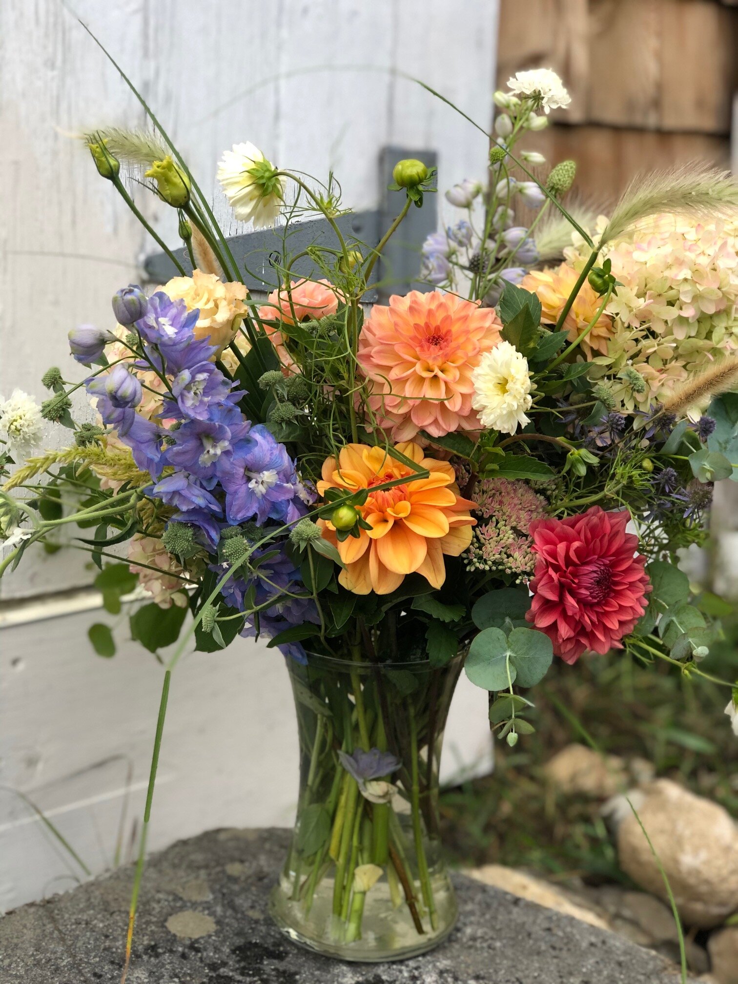 purple and orange vase arrangement