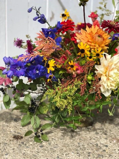 Bright and cheery vase arrangement with dahlias