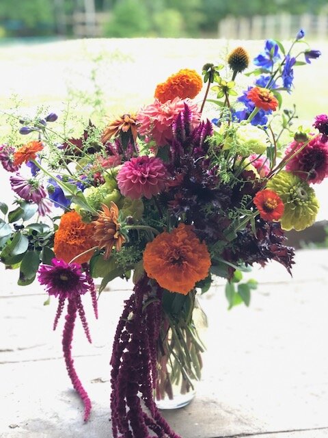fall tone flowers in a vase arrangement