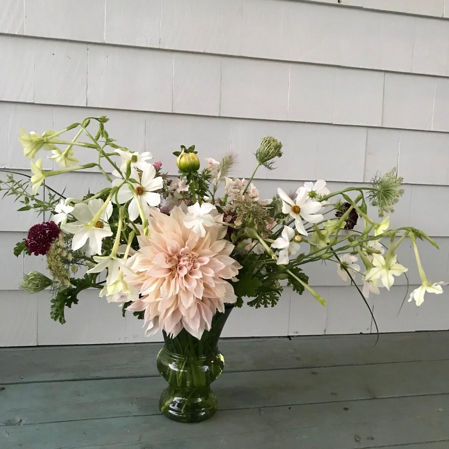 cafe au lait arrangement in green vase