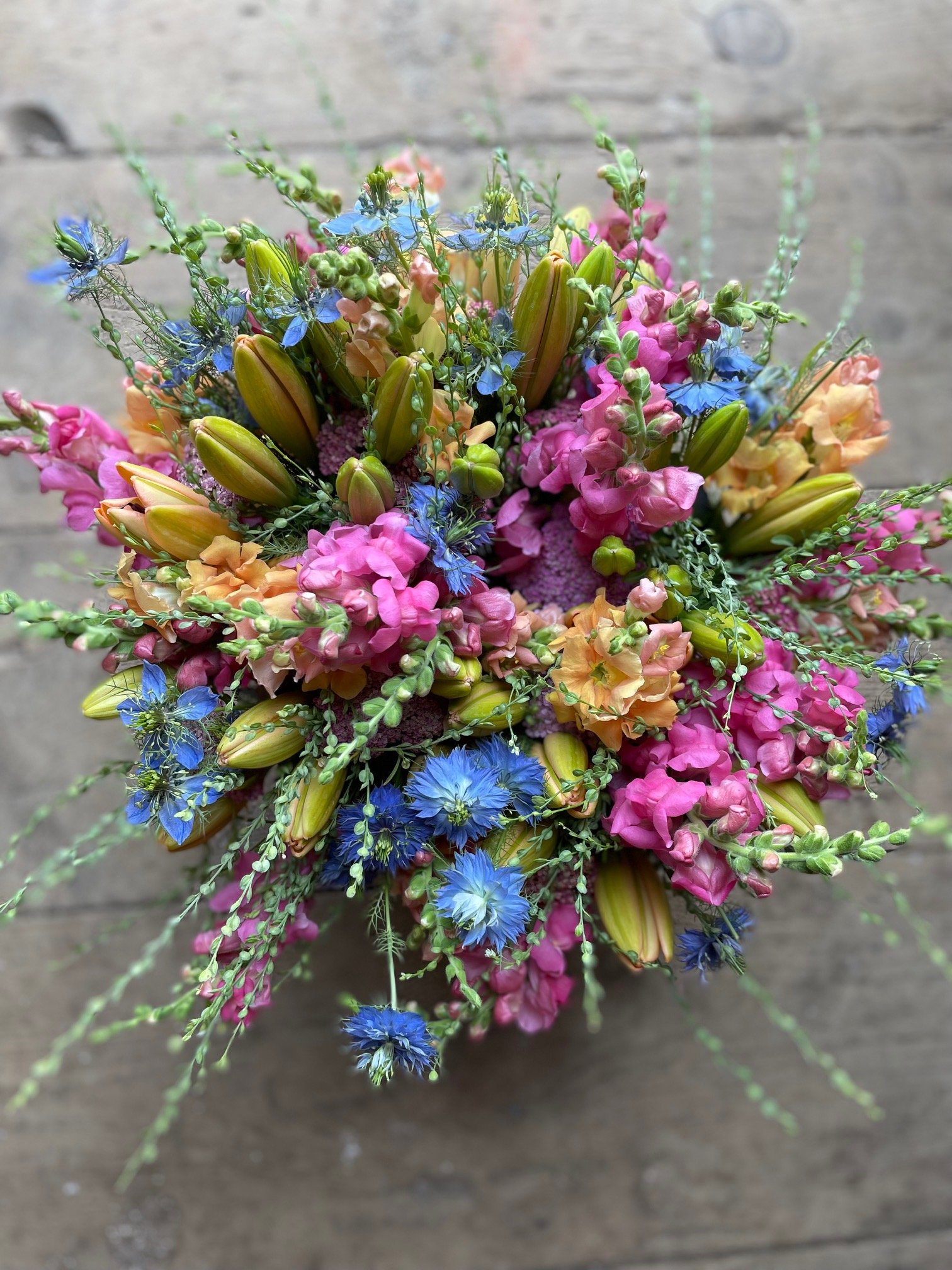 mixed blue, pink and orange market bouquets