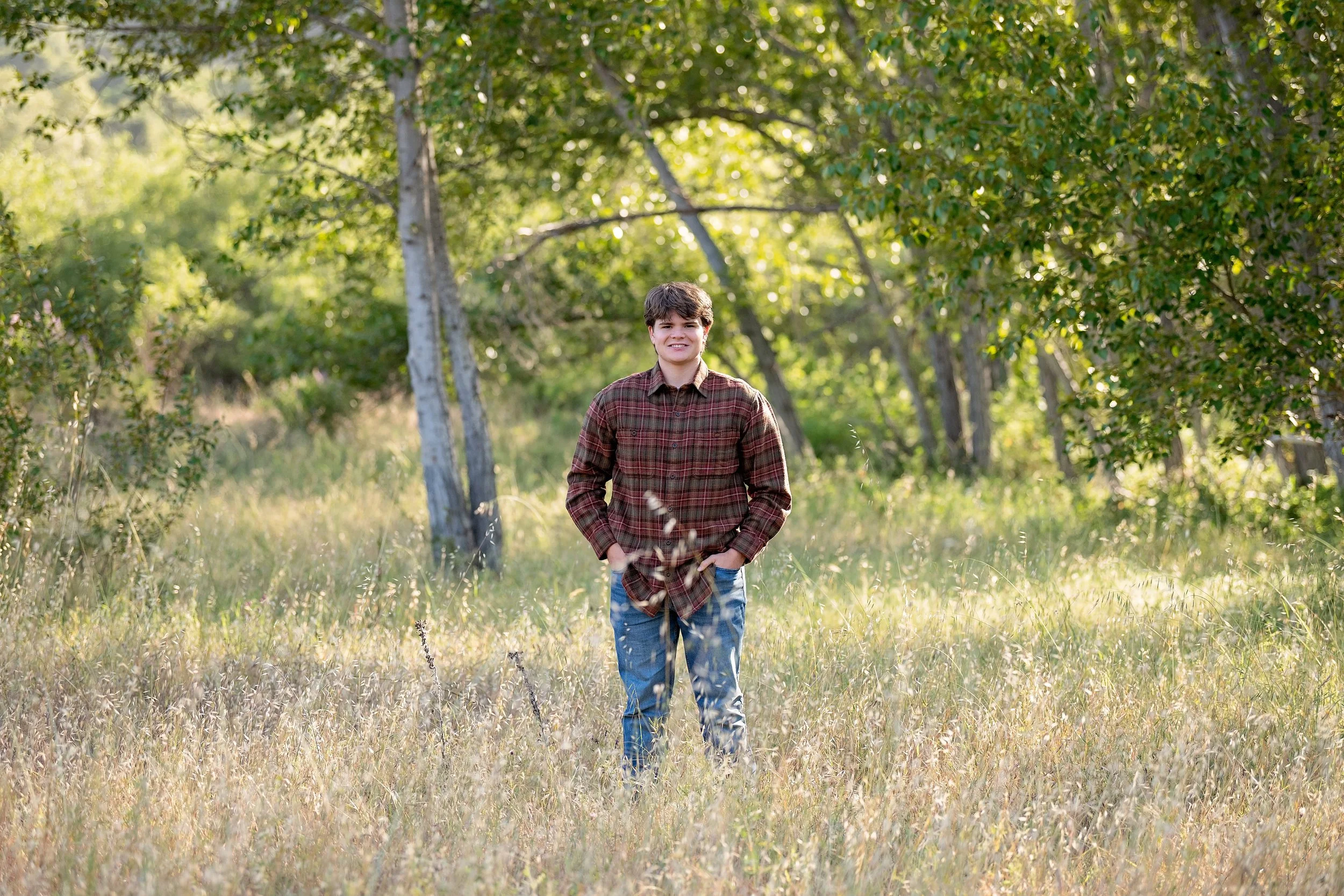 Salinas High School senior Gianni standing in a sunlit field at Garland Ranch in Carmel Valley.