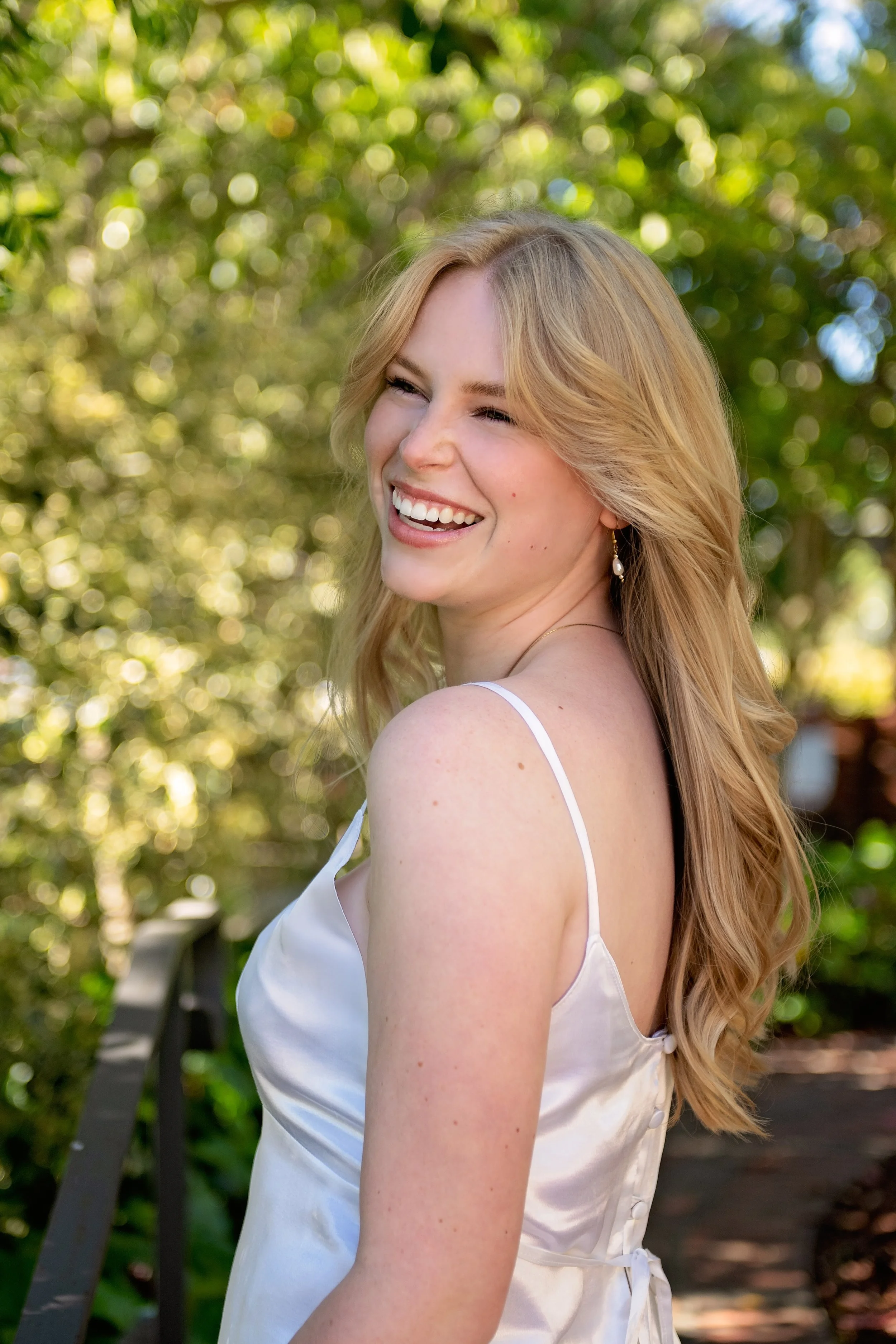 Close-up senior portrait of Camden photographed among the greenery in Carmel, California