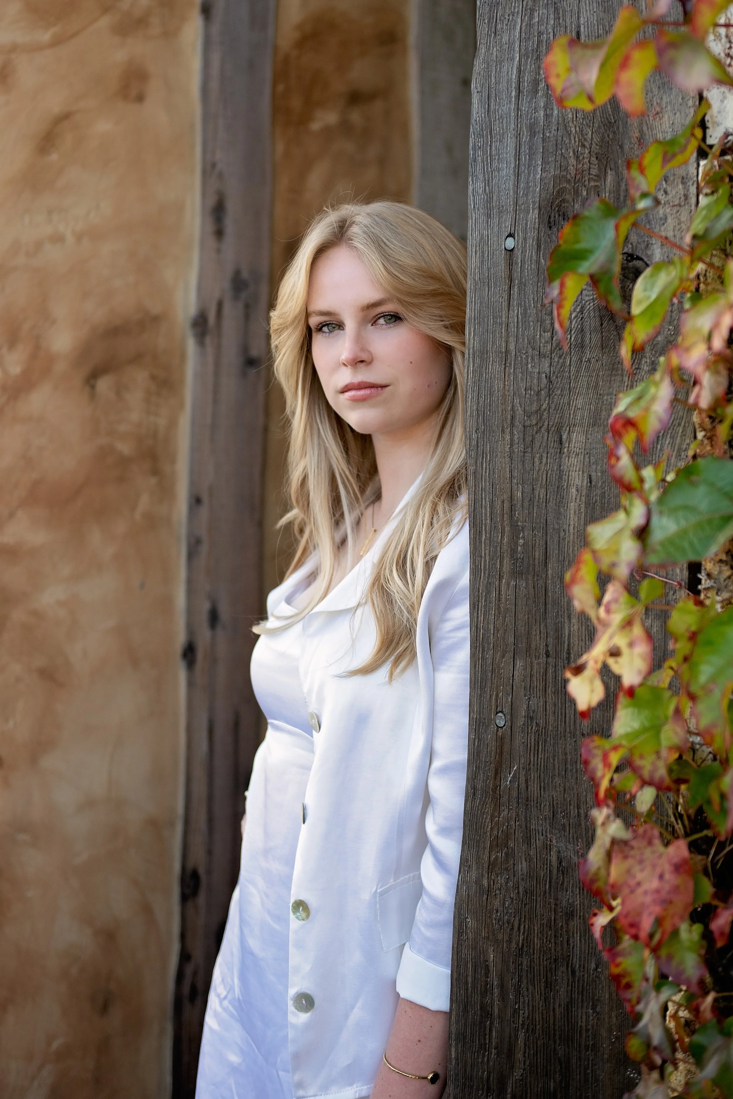 Close-up senior portrait of Camden photographed among the greenery in Carmel, California