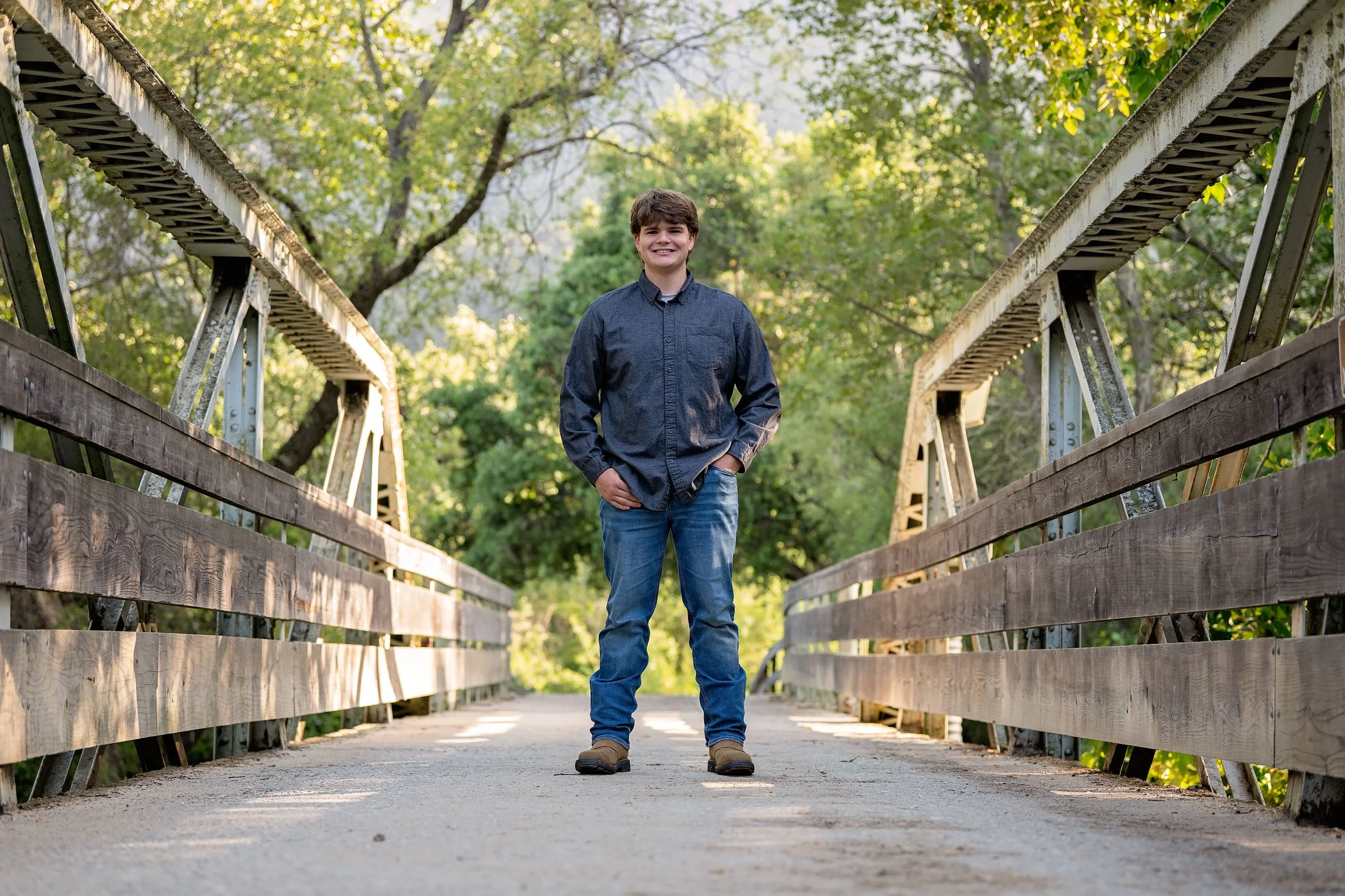 Gianni standing on the historic bridge at Garland Ranch during his Carmel Valley senior portrait session.