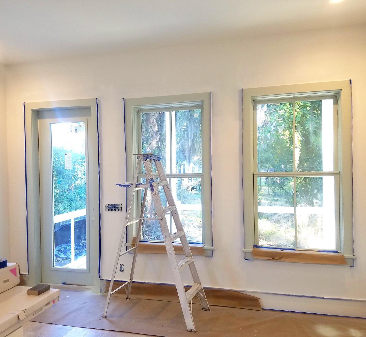Back windows and door painted SW Sea Salt and walls are BM Chantilly Lace. Fun to take a couple design risks on what will be our vacation home/rental! #beaufortdreamcottage  #sherwinwilliamsseasalt #benjaminmoorechantillylace #featurewall #paintedwin