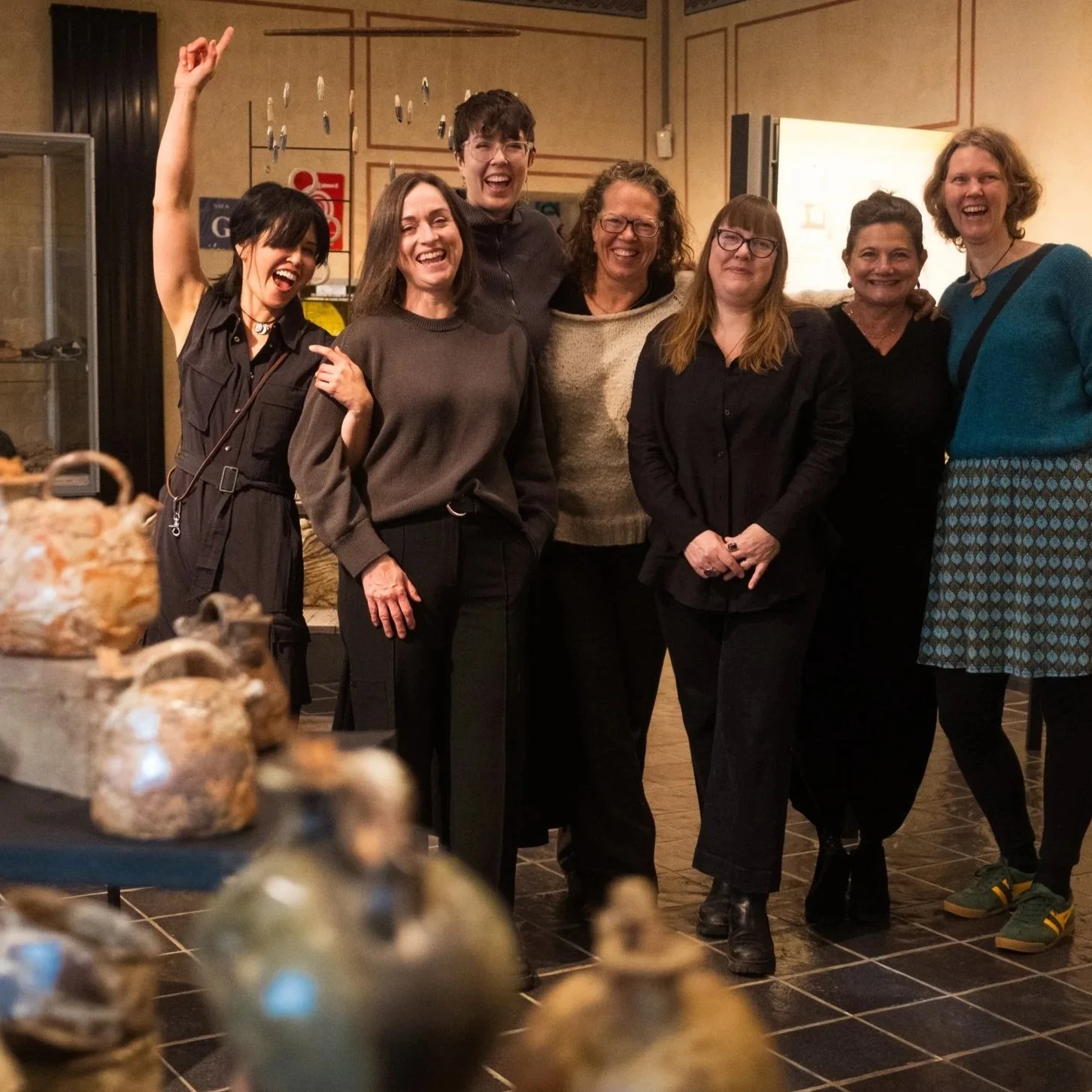 Group of ceramic artists at closing exhibition — The Long Work, The Six ceramics residency filmed at Il Baciarino, Tuscany