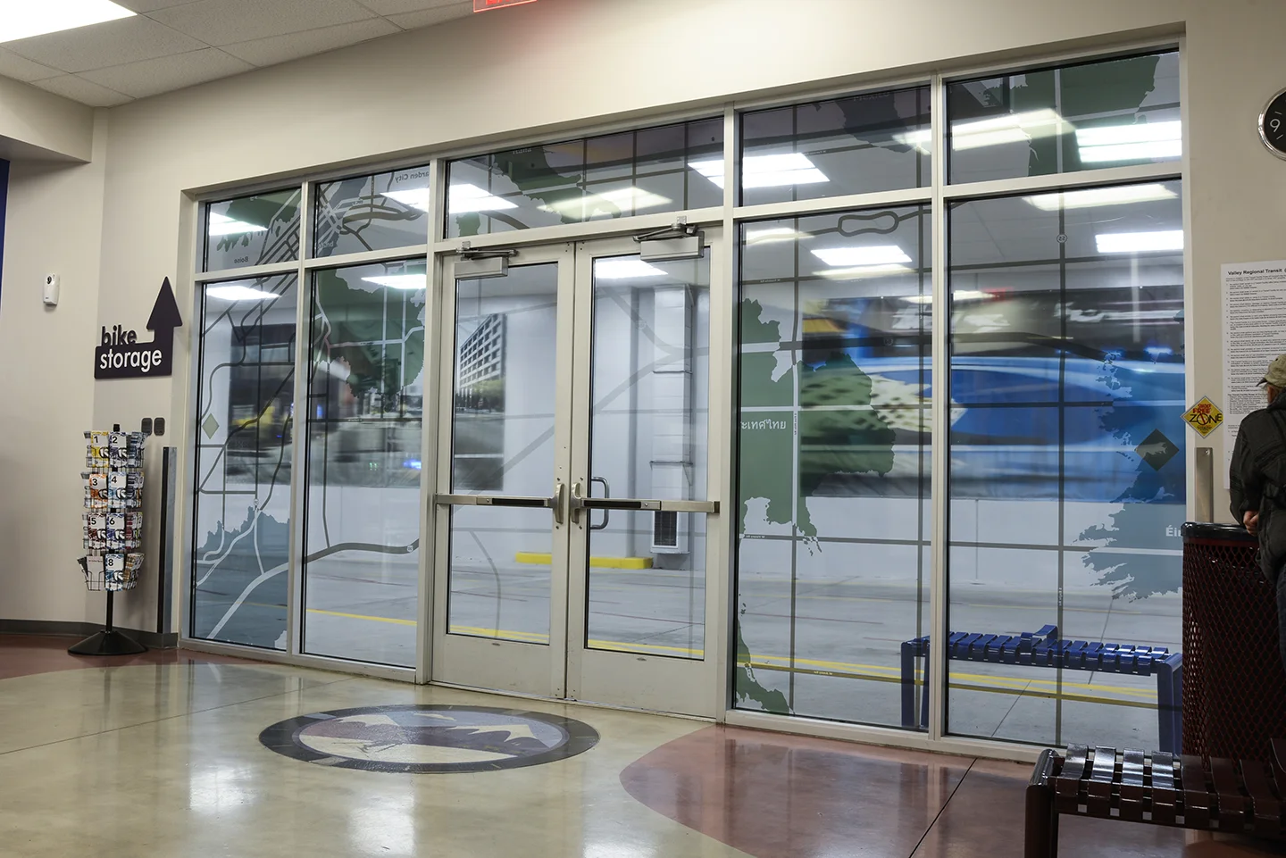 "The Commute: Idaho: Imports & Exports" vinyl on windows, Valley Regional Transit Station, Boise, Idaho, 2018