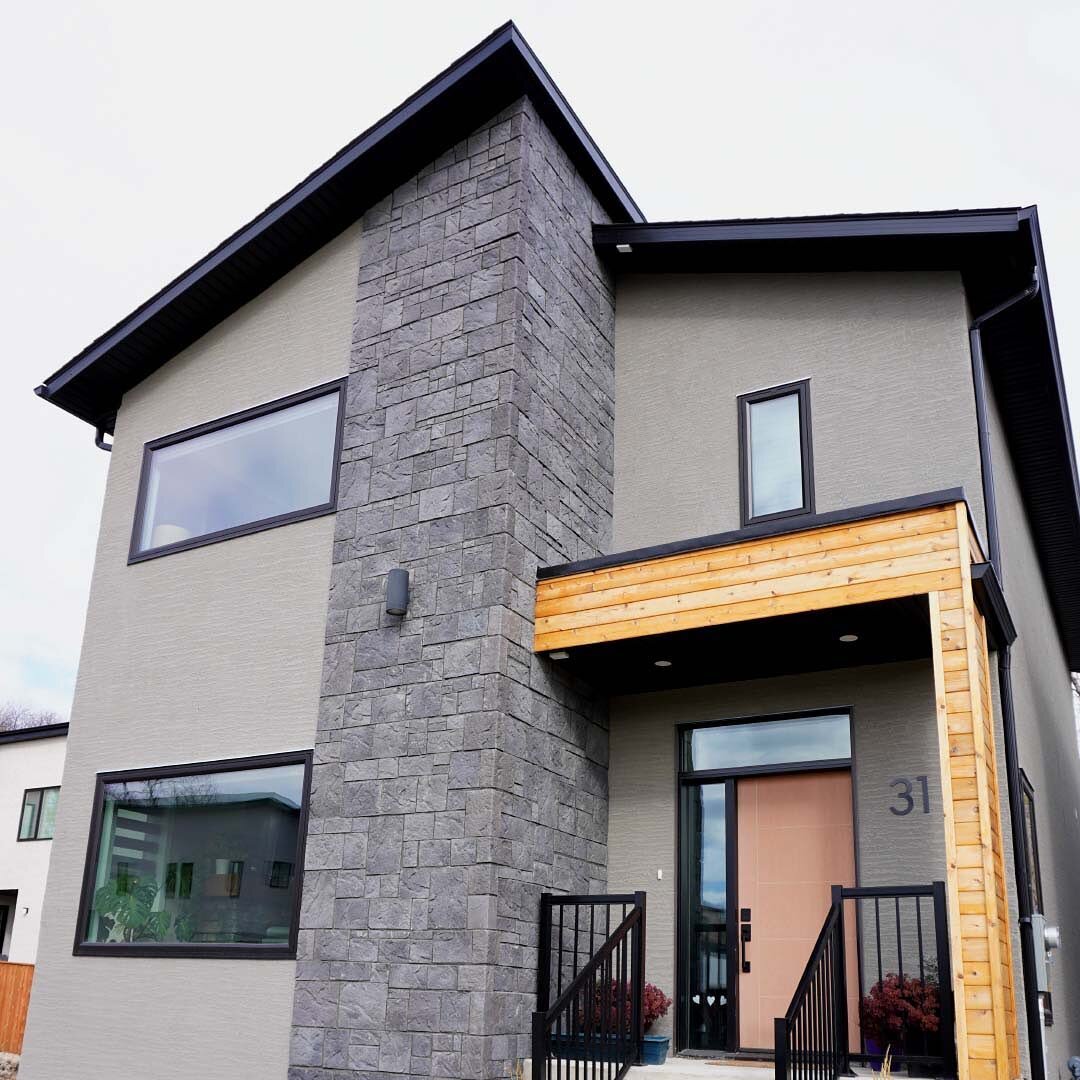 This Exterior 🤩⁣
⁣
We created a perfect balance between siding, stone and cedar wood that compliments the dynamic shape that will make you excited to come home every single time. ⁣
⁣
The options we provide at Dwell Design Homes are limitless. Our bi