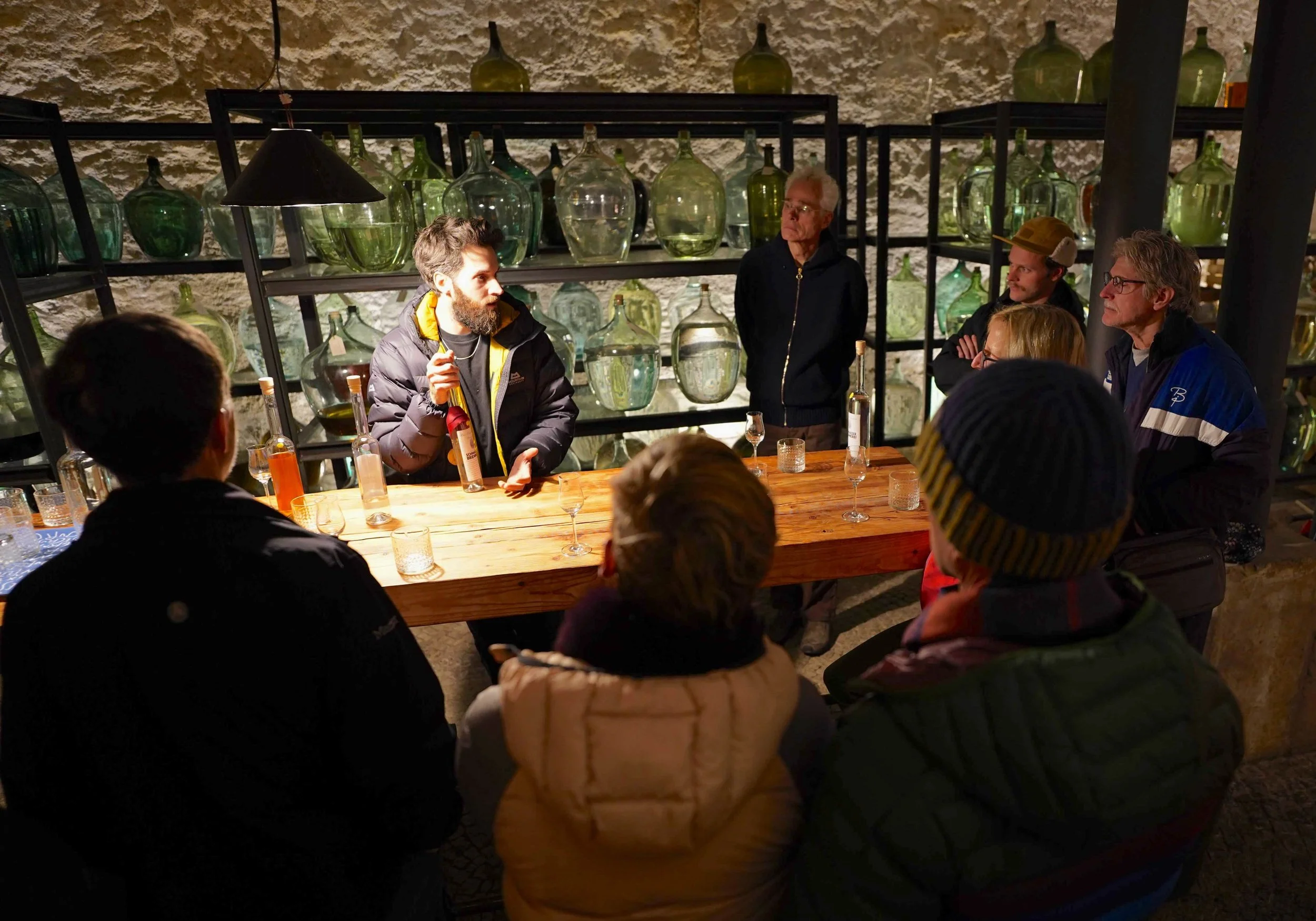 Lumi Guests taking a cultural post-ski break to visit an authentic local distillery and sample regional spirits in Lienz, Austria