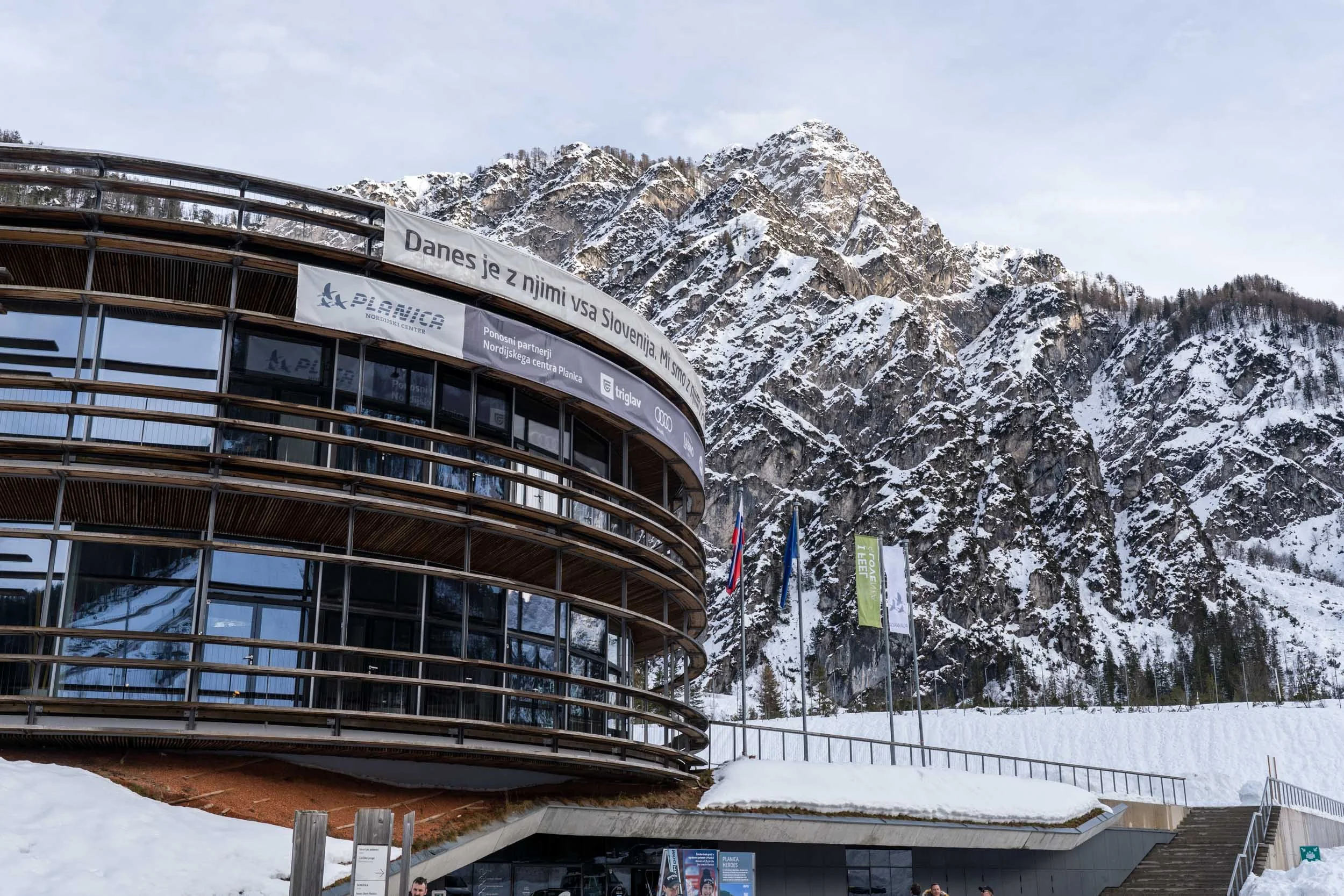 Planica Nordic Centre with iconic ski jumps surrounded by the snow-covered Julian Alps in Slovenia
