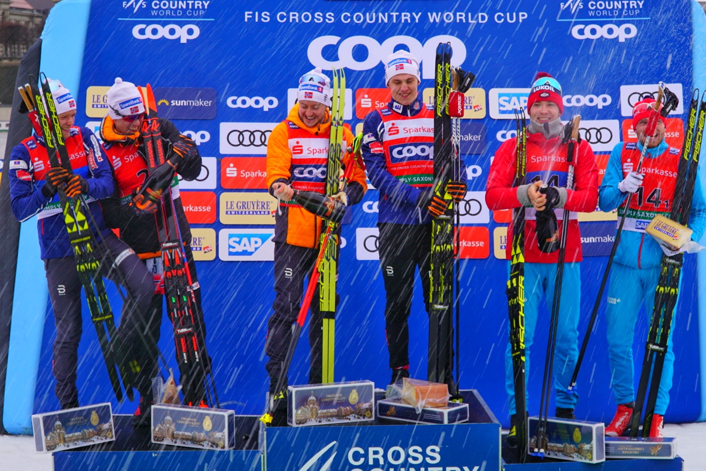 Men’s team sprint podium celebrates with champagne
