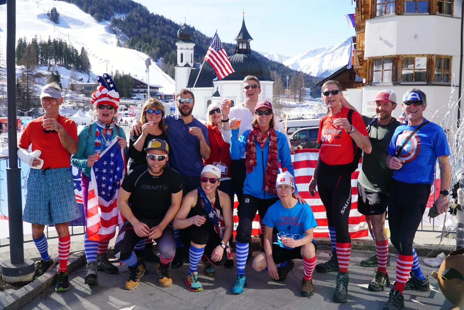 Guests on the 2019 World Championships trip in Seefeld, Austria get ready to watch the women’s 4 x 5km relay on the patio of their hotel with “relay socks” to support the team.