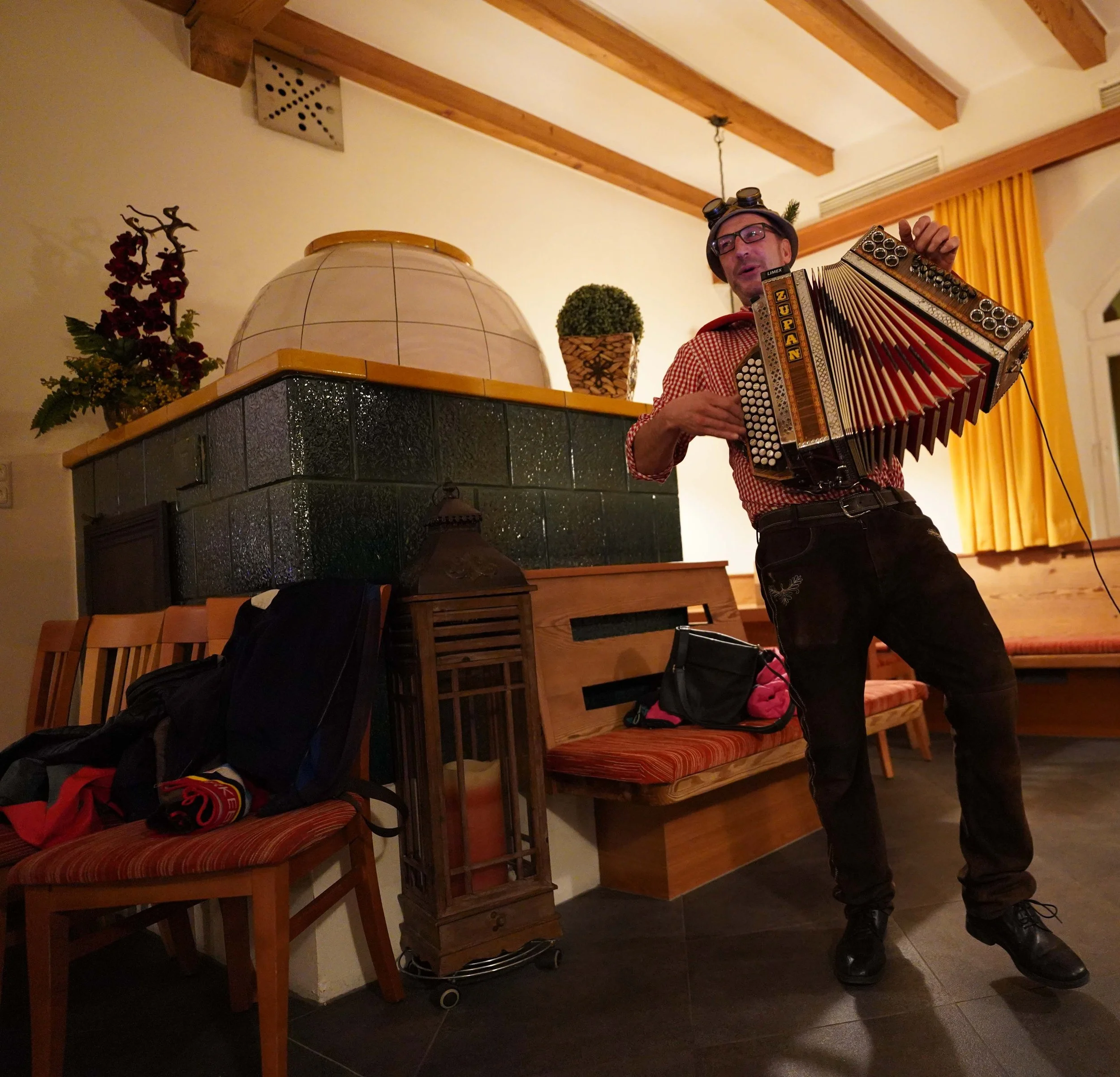 a man plays a traditional accordian (Ziehharmonika)
