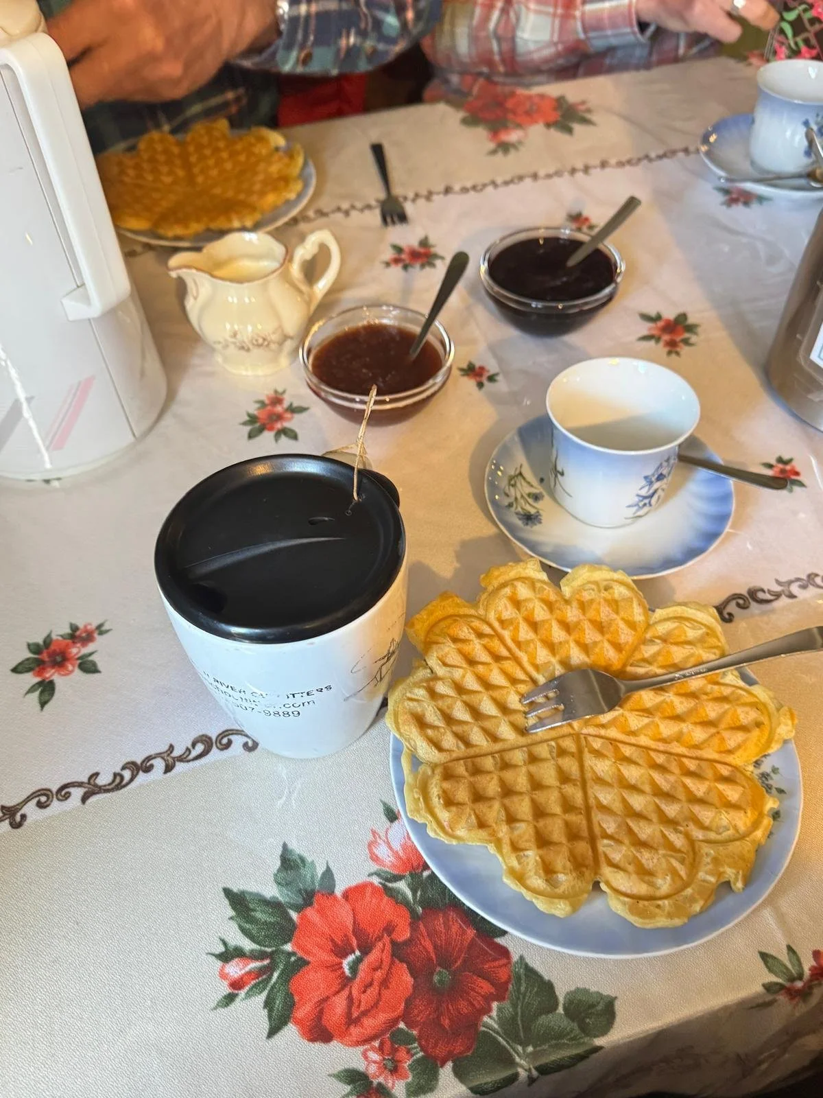 A traditional Icelandic waffle with jam and cream served at the historic Litlibær turf house cafe