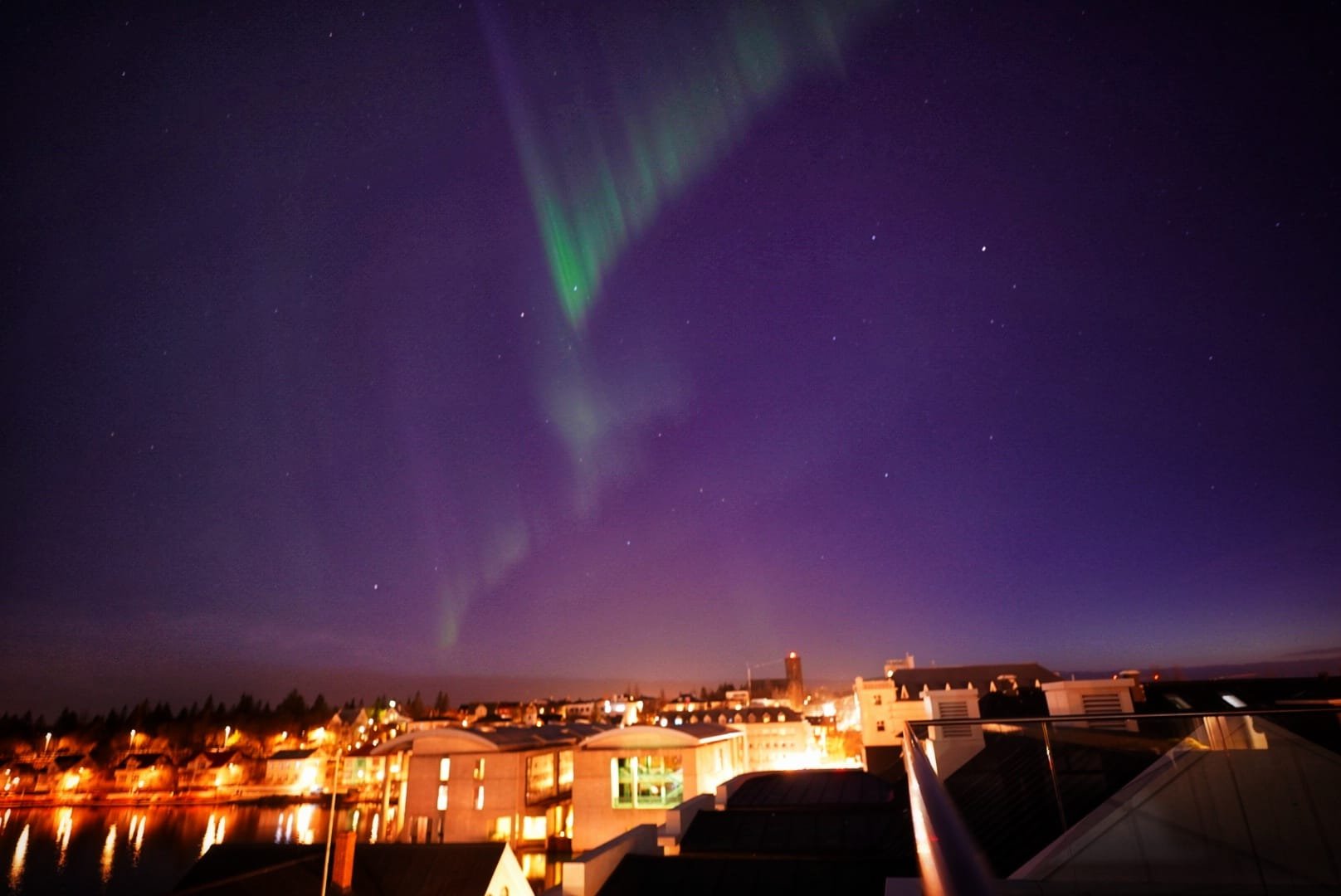 "Northern lights illuminating the winter sky over Ísafjörður, Iceland