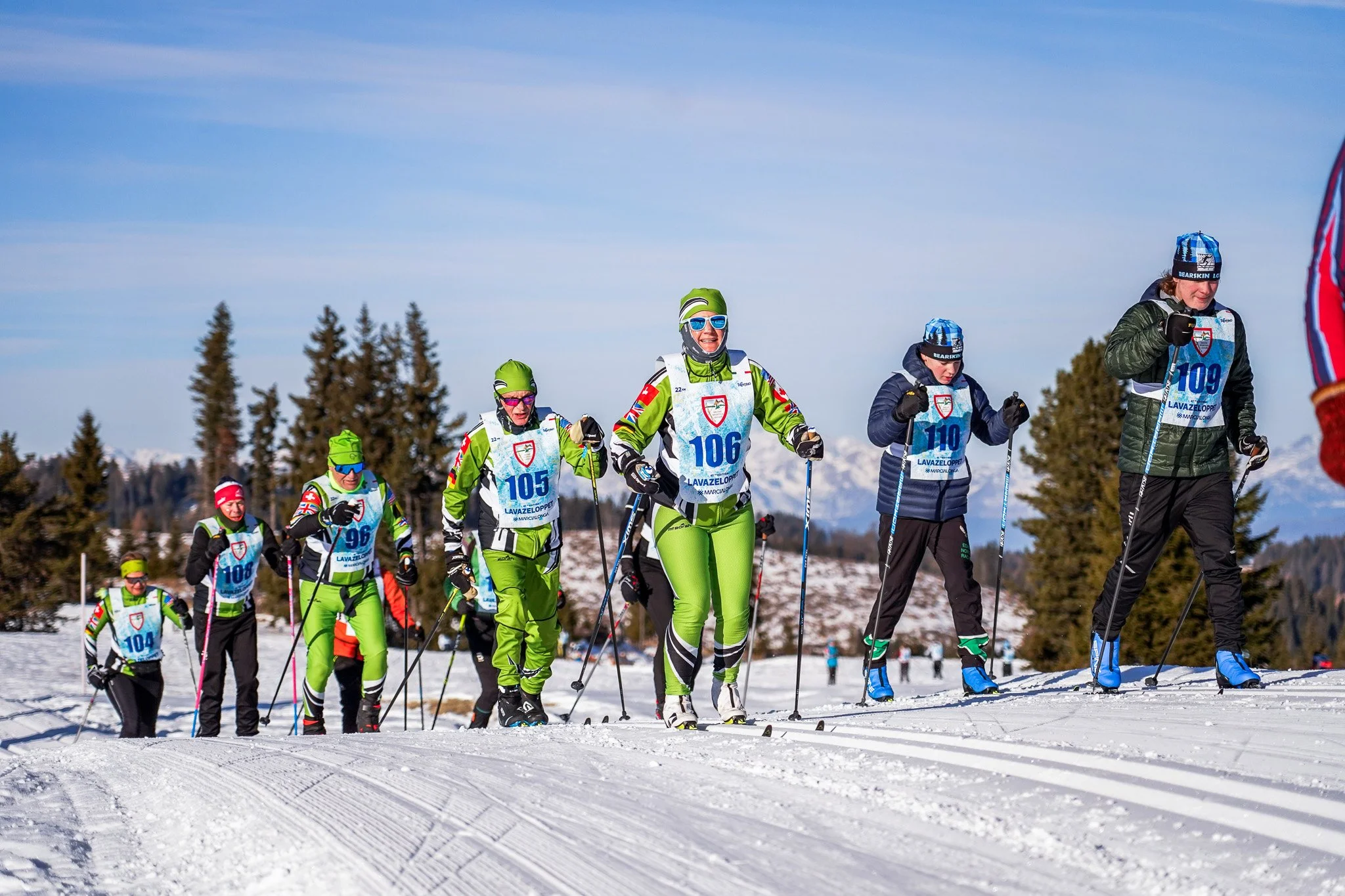Happy family skiing on perfectly groomed slopes during a Lumi winter vacation