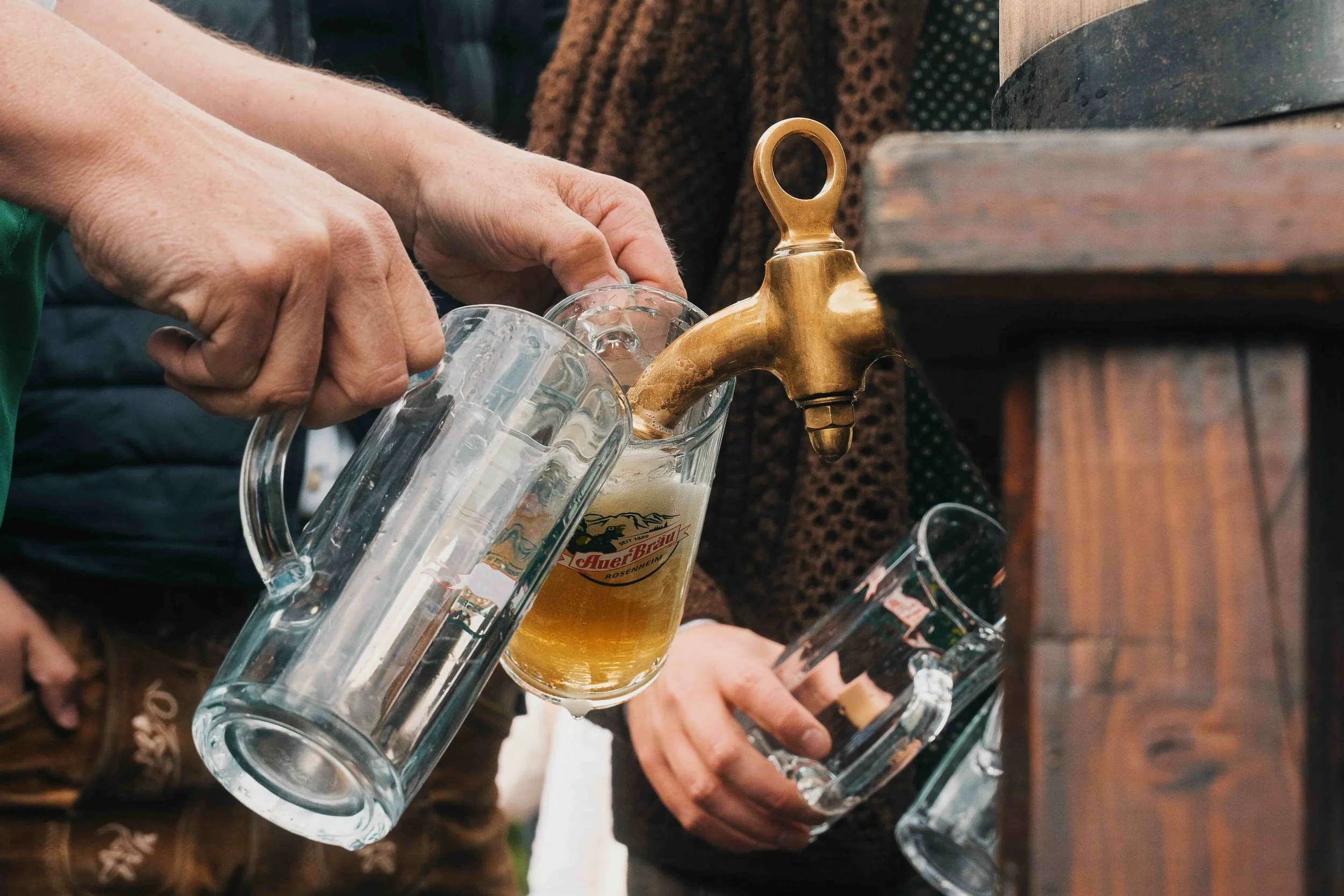 Draft German beer being poured into glass mugs after the König Ludwig Lauf race in Oberammergau