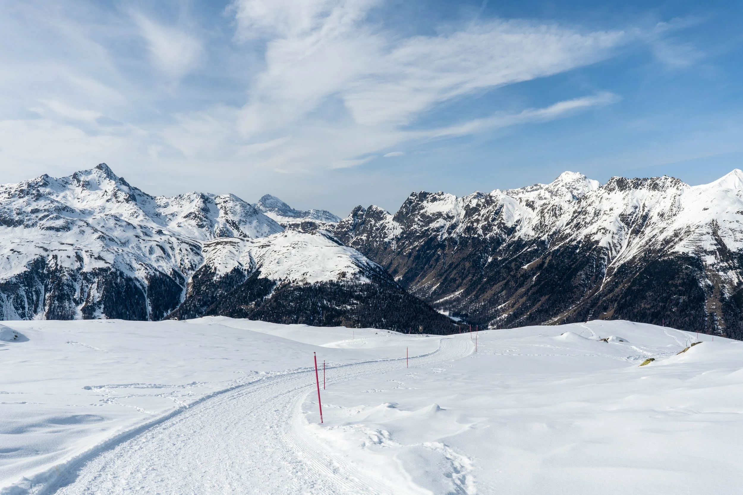 Snow-covered, groomed paths atop Muottas Muragl ideal for winter exploring in Engadin