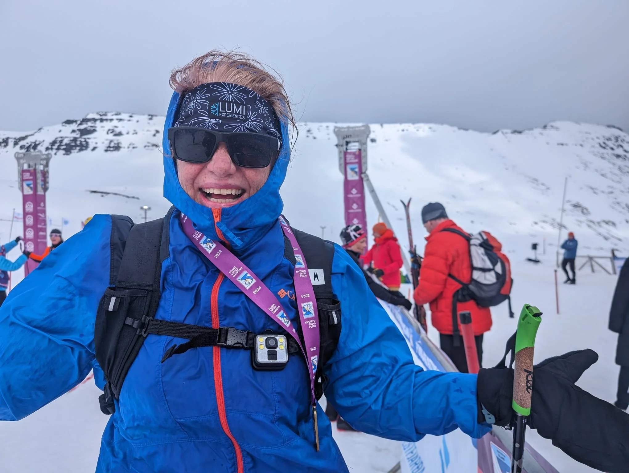 A triumphant skier celebrating their joyful finish at the end of Iceland's Fossavatn Worldloppet event.