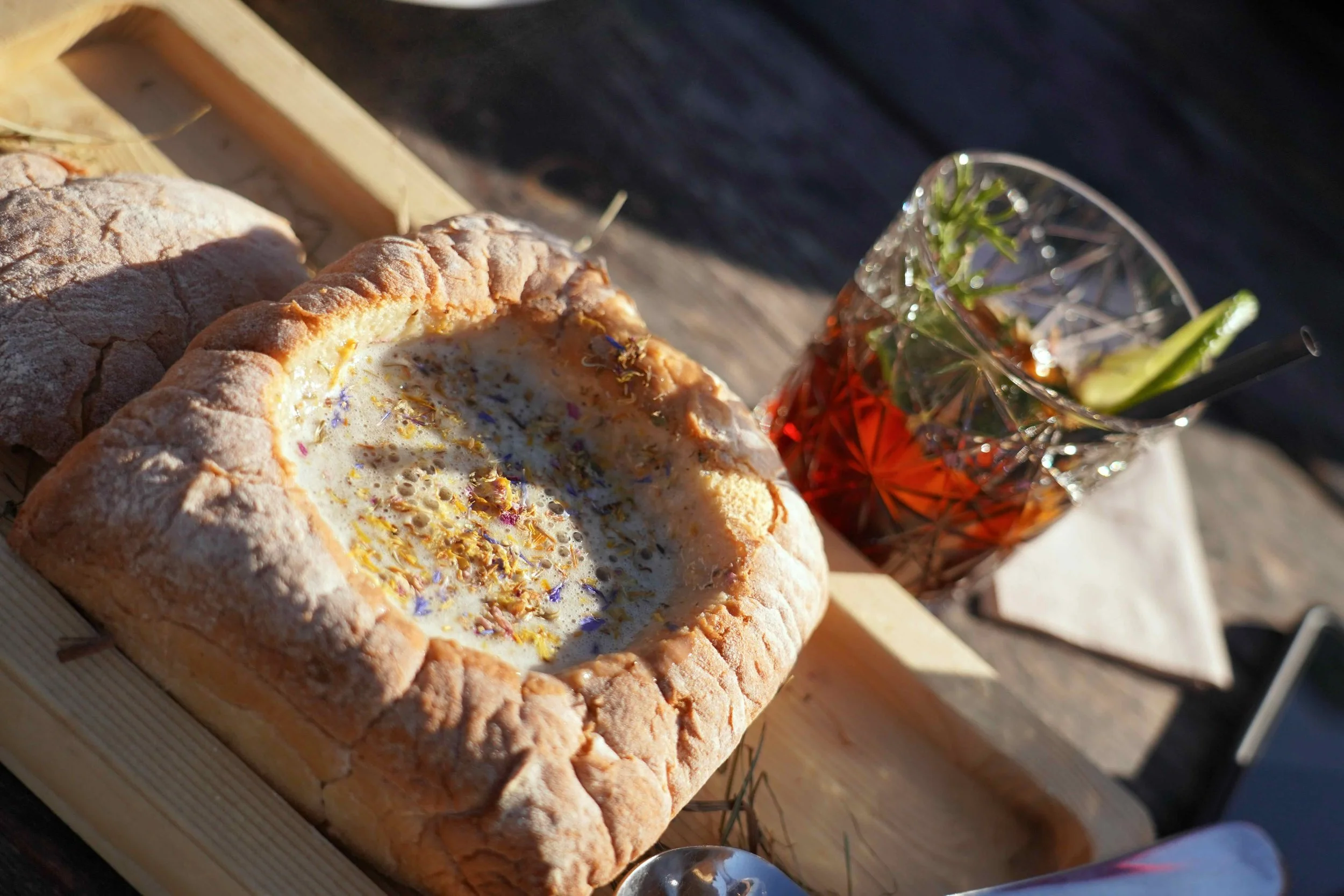 Traditional alpine hut cuisine with hay soup and wildflower cocktails on the trails of Seiser Alm