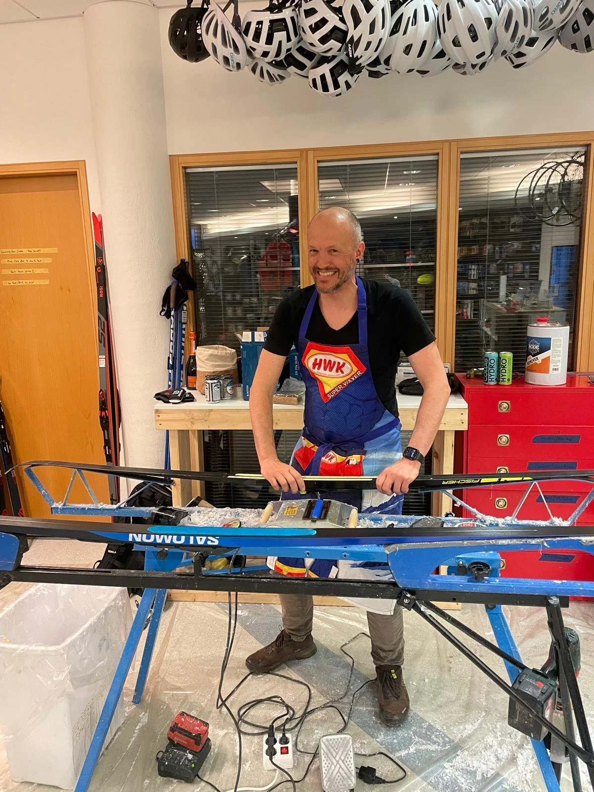Ski technician Florian waxing cross-country skis