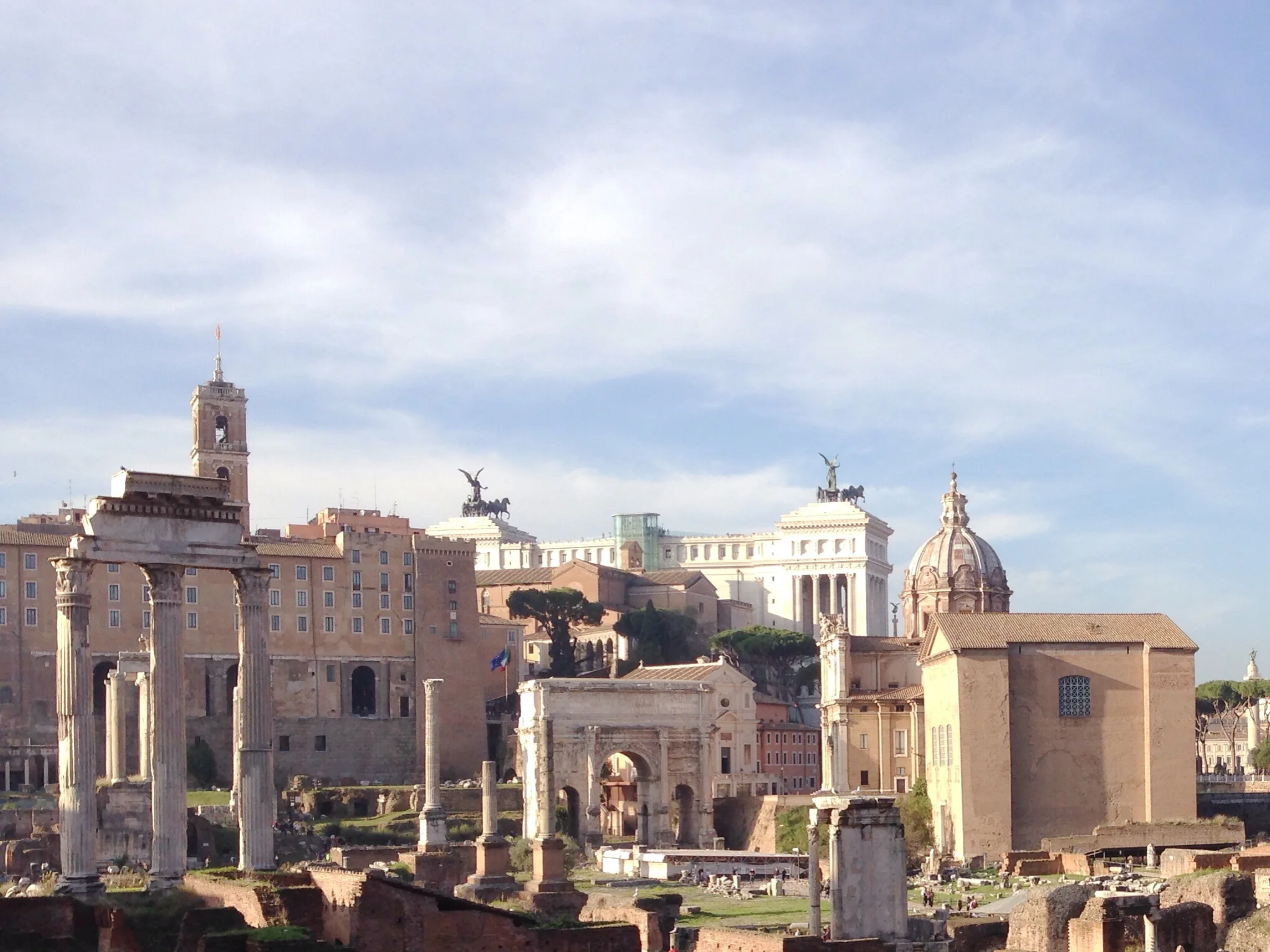 Views of the temple of Castor and Pollux, hearth of the Vestal Virgins, and Arch of Septimius Severus in the Roman Forum in Rome, Italy.