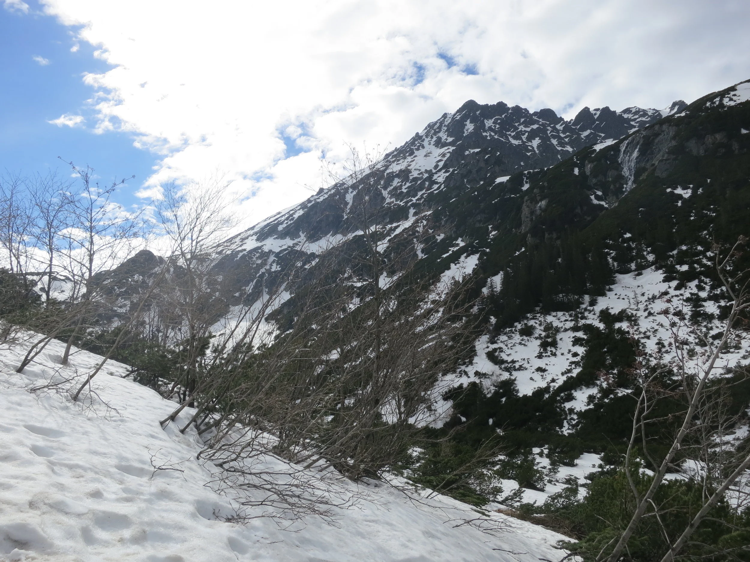 The sun finally peeks through the clouds, on the hike to Dolina Pięciu Stawów.