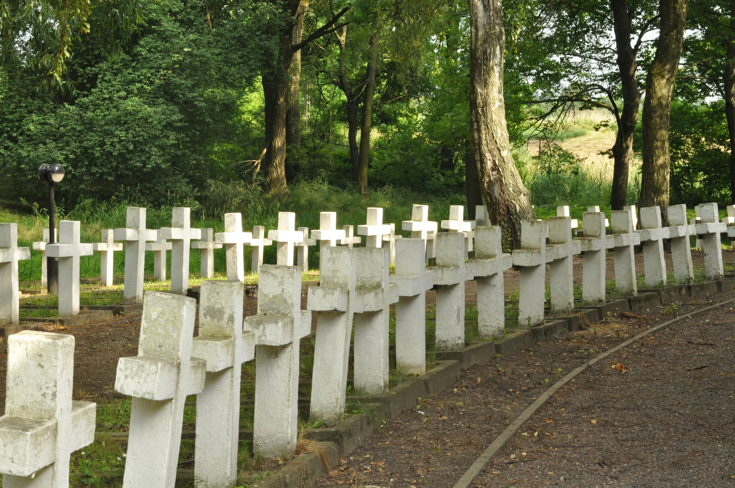 Crosses mark graves outside of the Rotunda in Zamosc, Poland