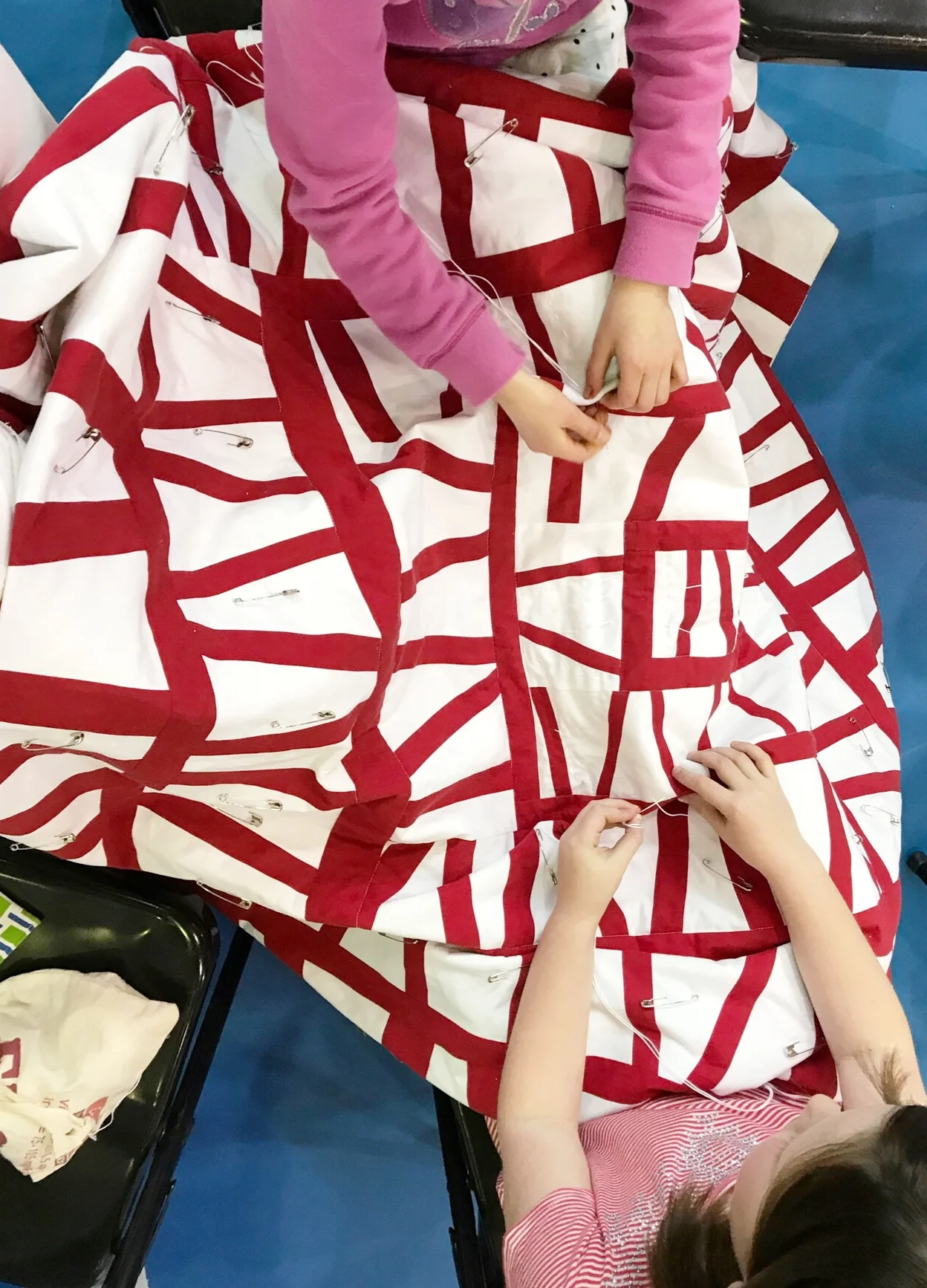 Handquilting a Modern Improv Quilt at a School Maker’s Faire