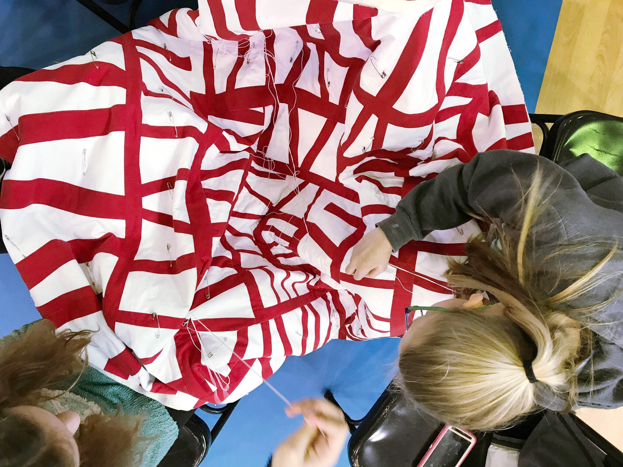 Handquilting a Modern Improv Quilt at a School Maker’s Faire