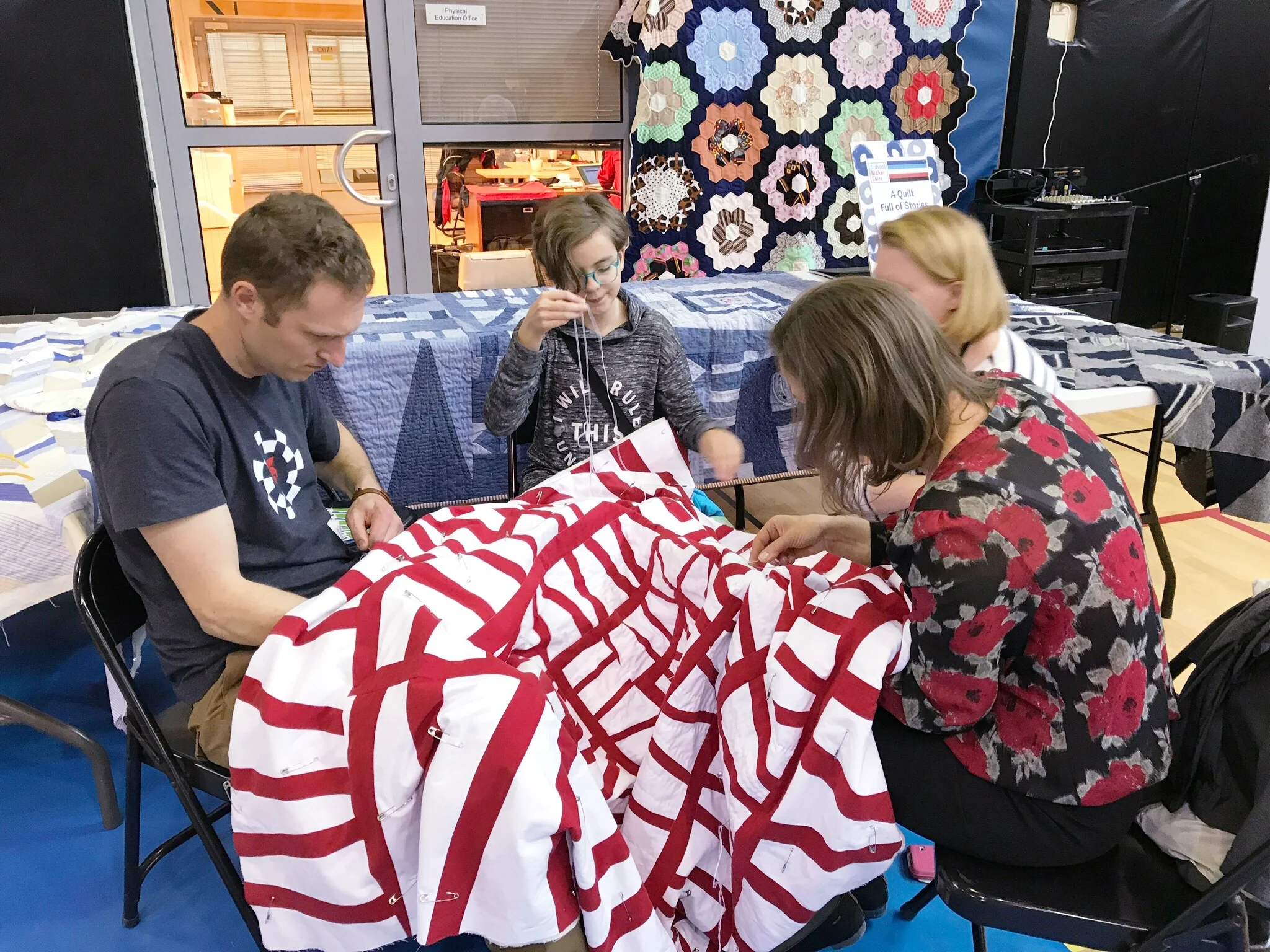 Handquilting a Modern Improv Quilt at a School Maker’s Faire