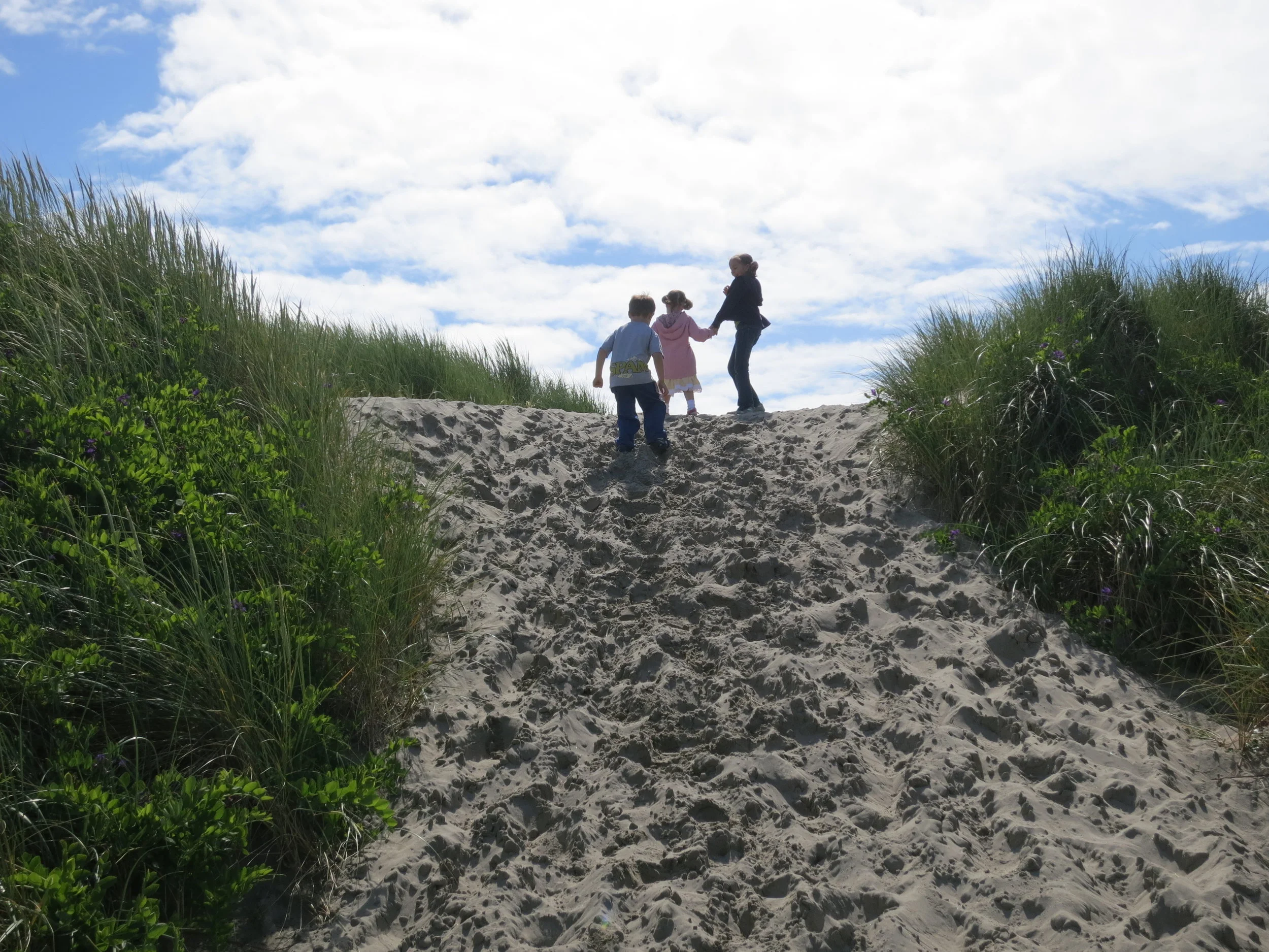 Walking up the sand dunes on the Oregon coast