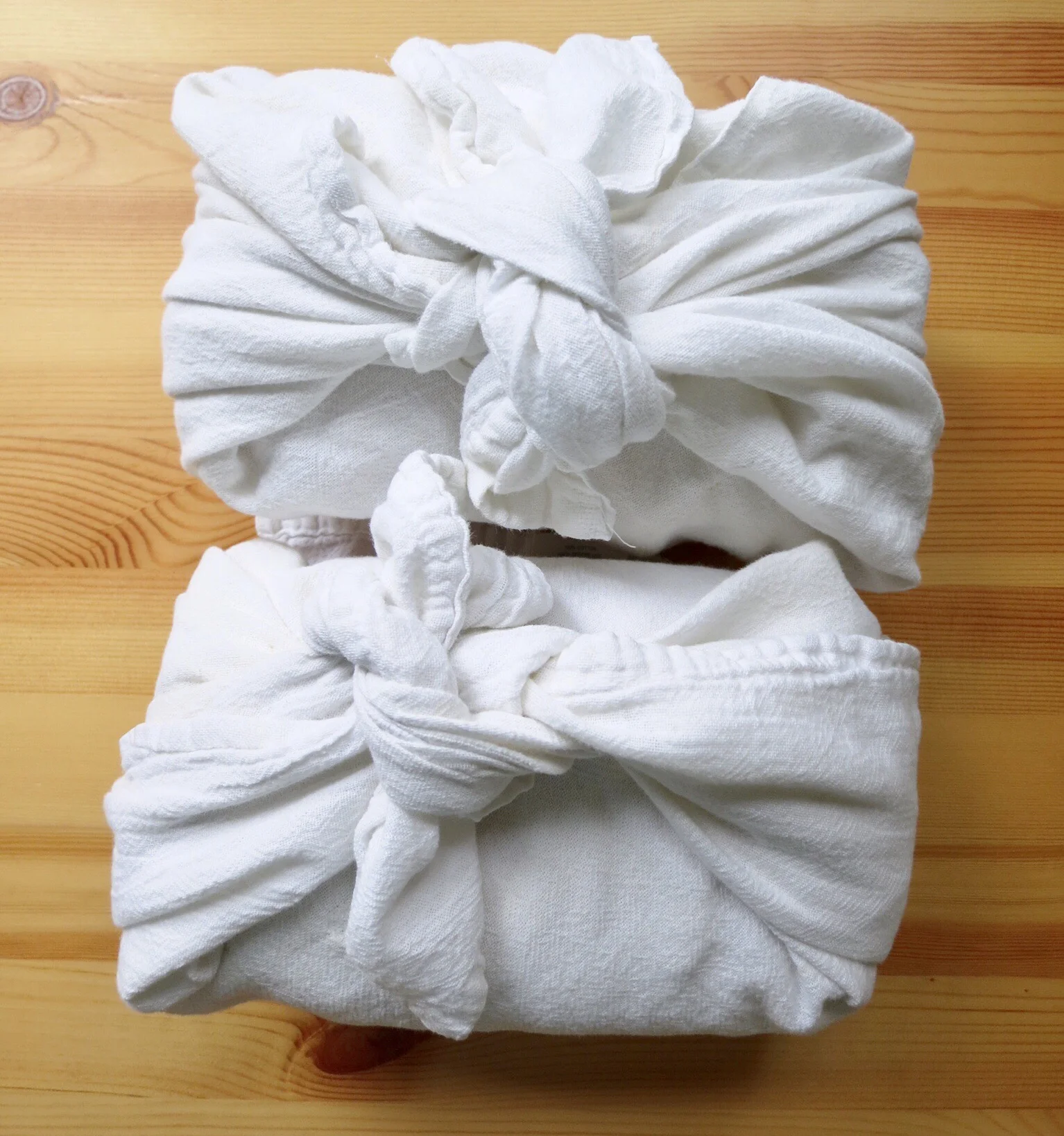 Fresh baked bread wrapped in dish towels—a tiny gratitude in my life. 