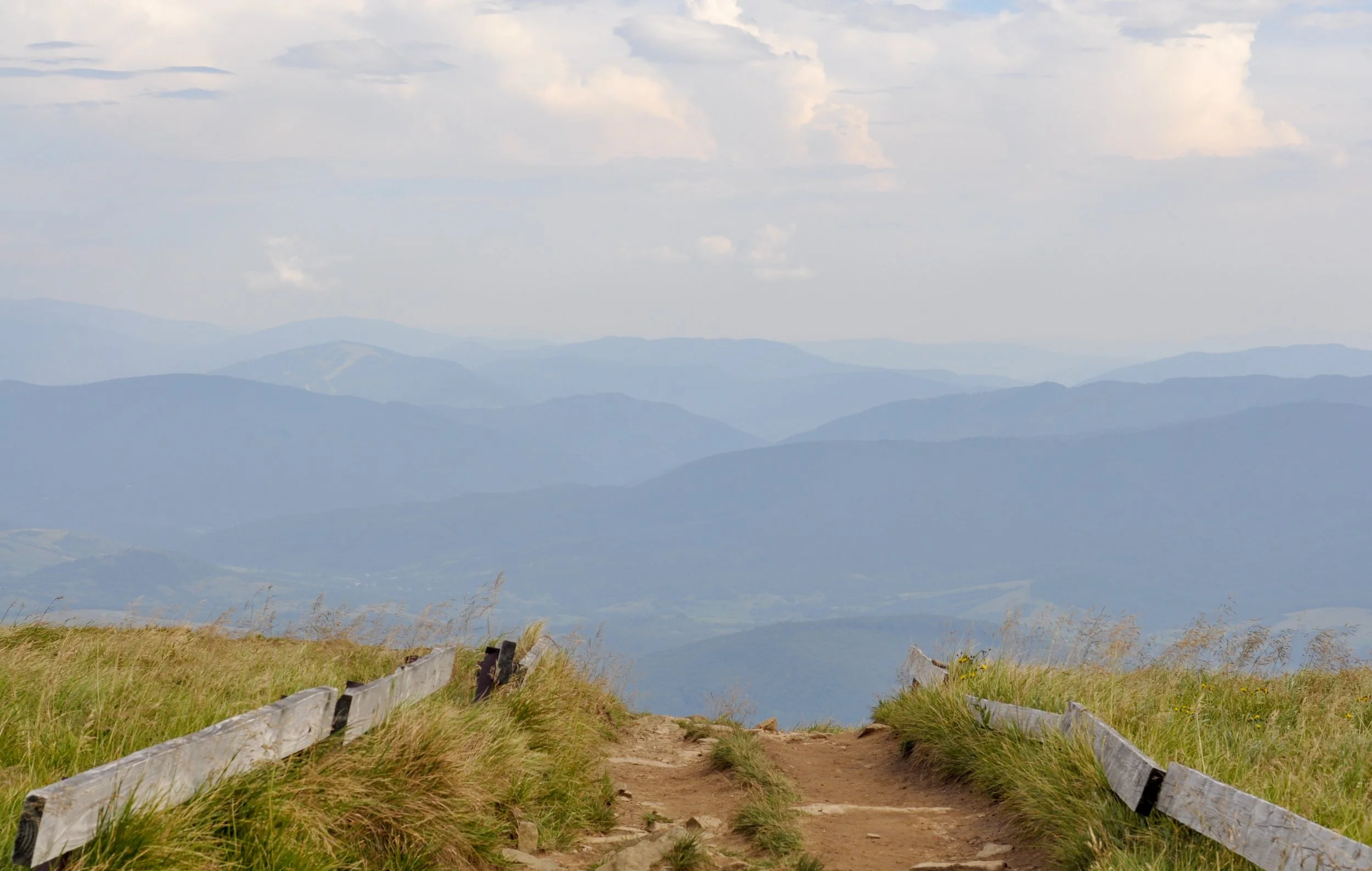 Trail descending a hill in the połoniny on the Tri-Border hike in the Bieszcady Mountains