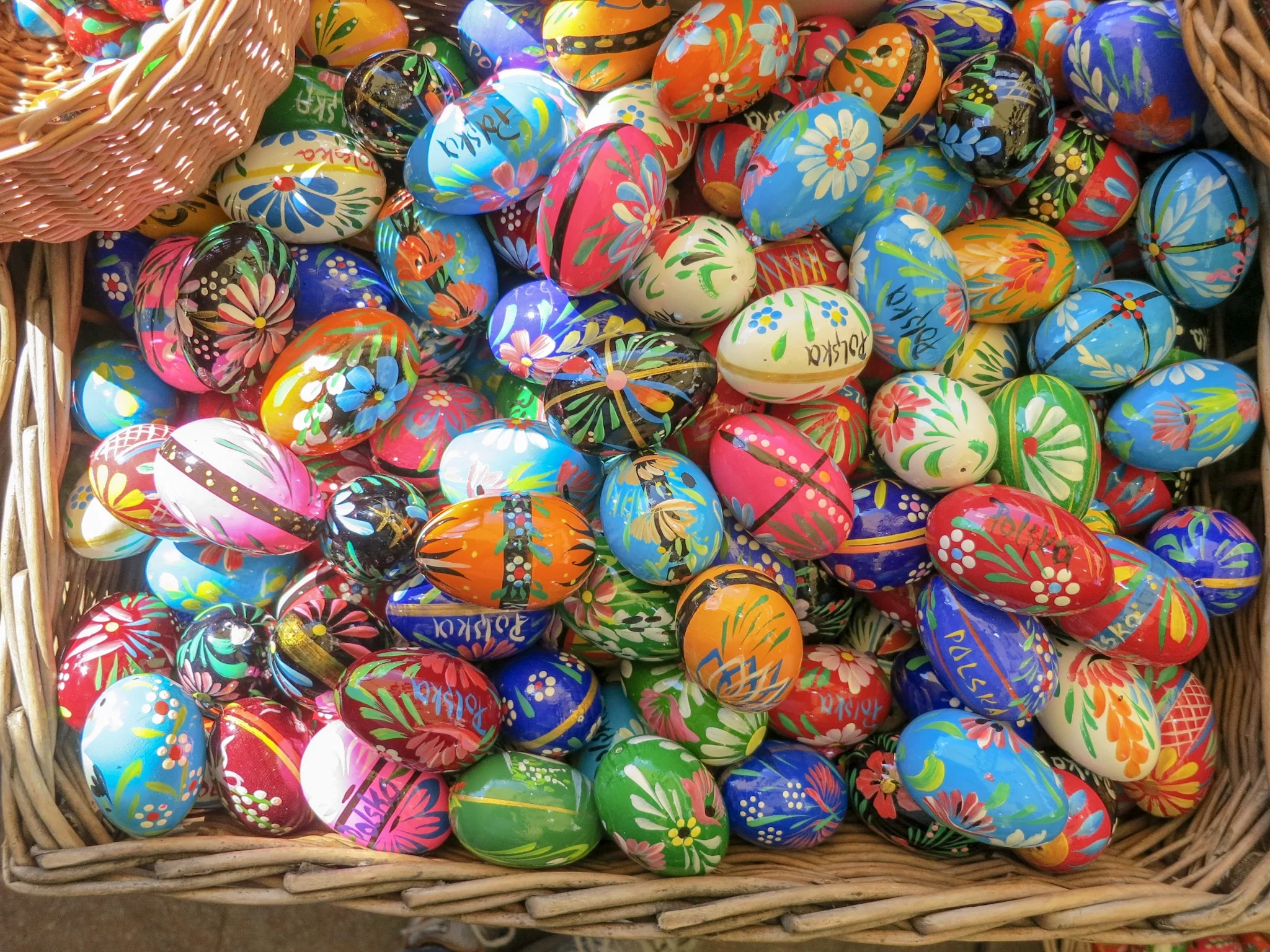 Wooden eggs painted with folkart and the word Polska