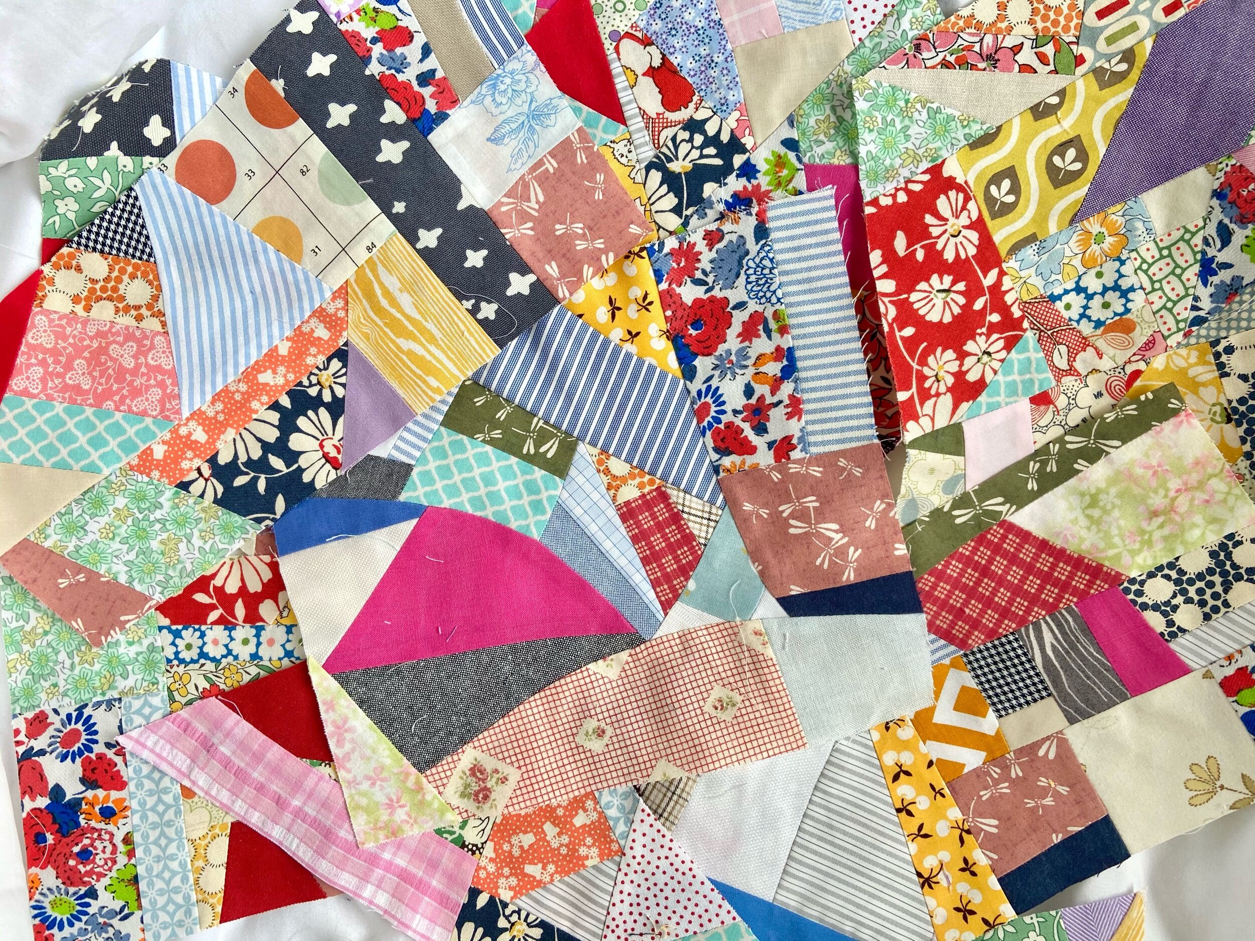 Improv pieced quilted pieces in many different fabrics