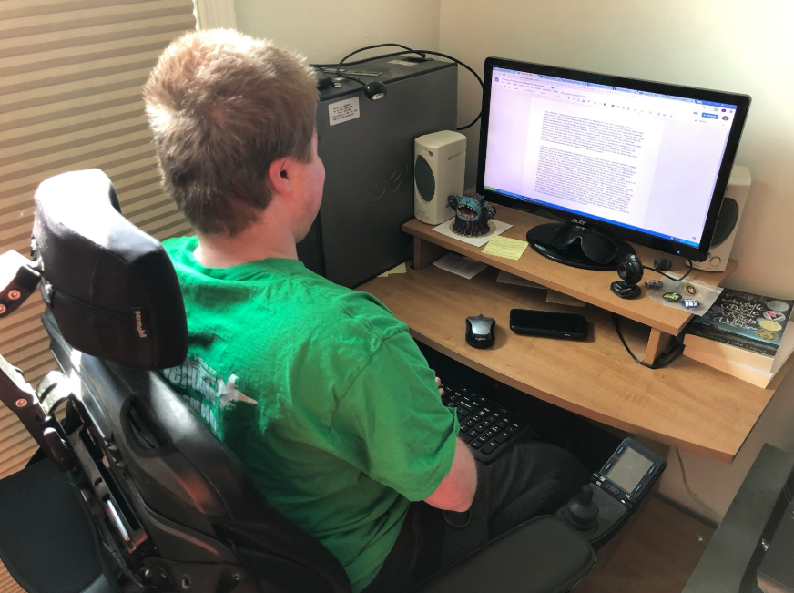 Jack Wolf working on a writing assignment for Jett Foundation.